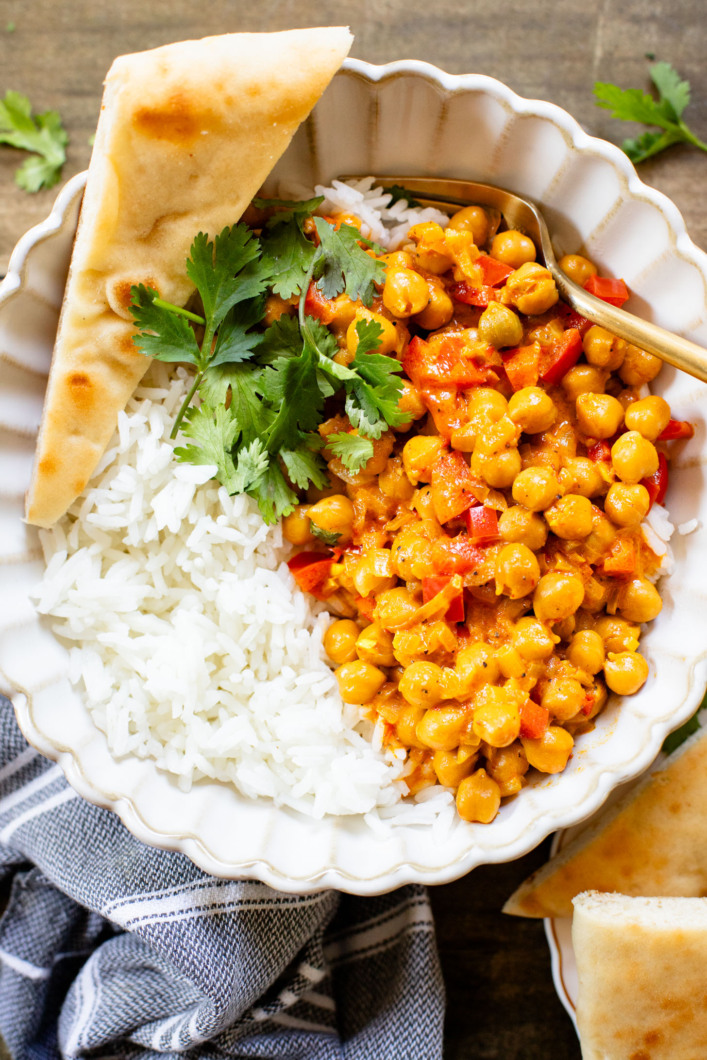 This Coconut Harissa Chickpea Skillet is an easy weeknight dinner that is dairy-free and packs in veggies & plant protein in a creamy sauce | ThisSavoryVegan.com