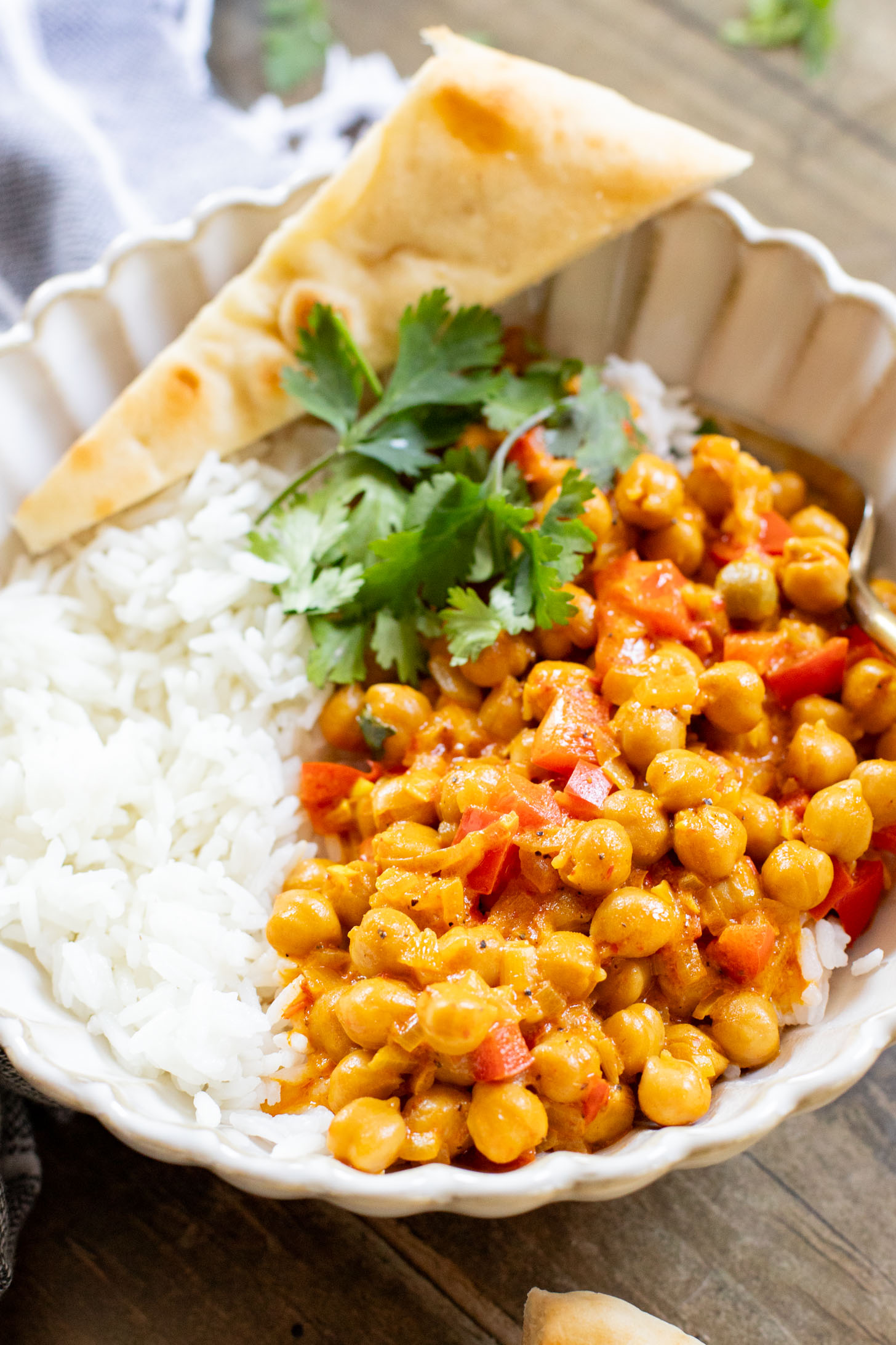 This Coconut Harissa Chickpea Skillet is an easy weeknight dinner that is dairy-free and packs in veggies & plant protein in a creamy sauce | ThisSavoryVegan.com
