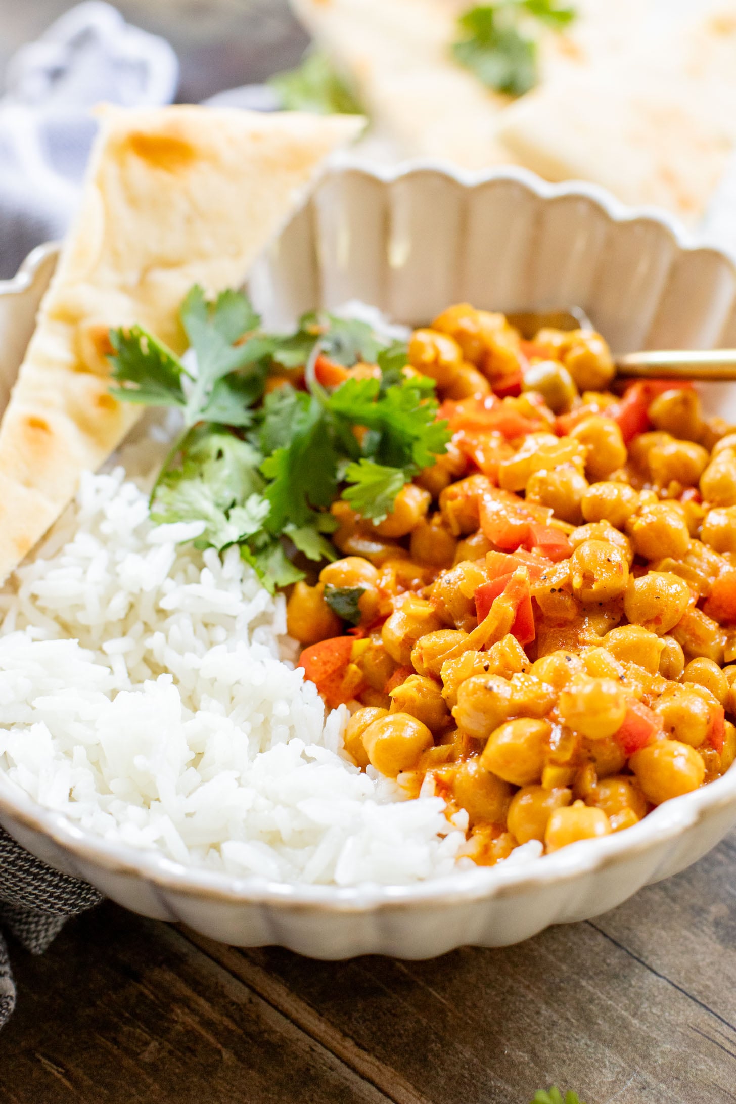 This Coconut Harissa Chickpea Skillet is an easy weeknight dinner that is dairy-free and packs in veggies & plant protein in a creamy sauce | ThisSavoryVegan.com
