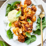 This Sheet Pan Vegan Sausage & Cauliflower is the perfect weeknight dinner. Served over rice with a pesto aioli | ThisSavoryVegan.com