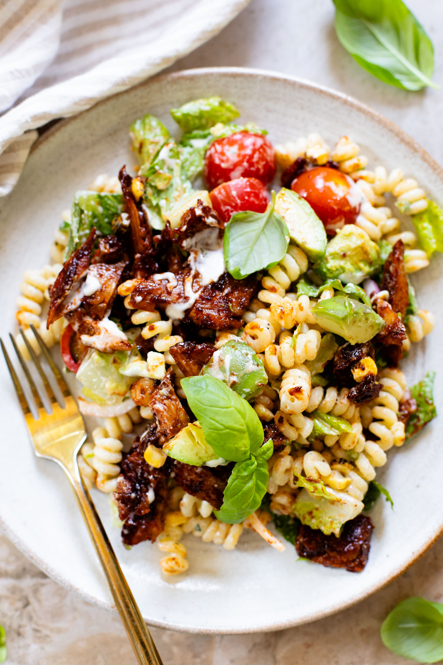 This Vegan BBQ Chicken Pasta Salad is a summer must make! Crisp veggies, charred vegan chicken and the best dairy-free creamy dressing | ThisSavoryVegan.com