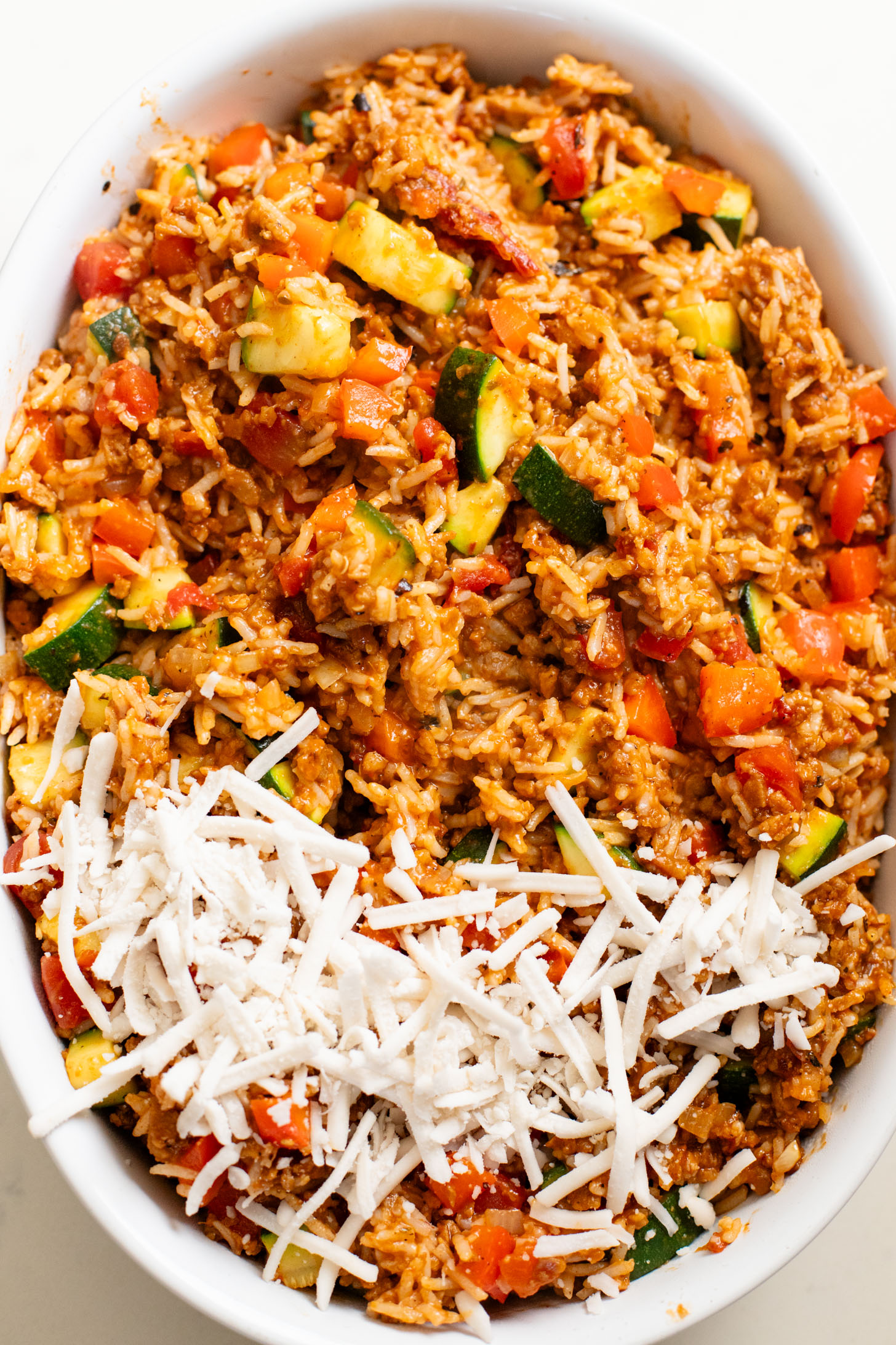 This Vegan Beef Zucchini Casserole is a hearty & delicious dinner idea. You get rice, veggies & plant protein in one tasty dish | ThisSavoryVegan.com
