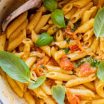 This 5-Ingredient Tomato Basil Penne is a quick, one-pot dinner! The cherry tomatoes & dairy-free cream make the best pasta sauce | ThisSavoryVegan.com