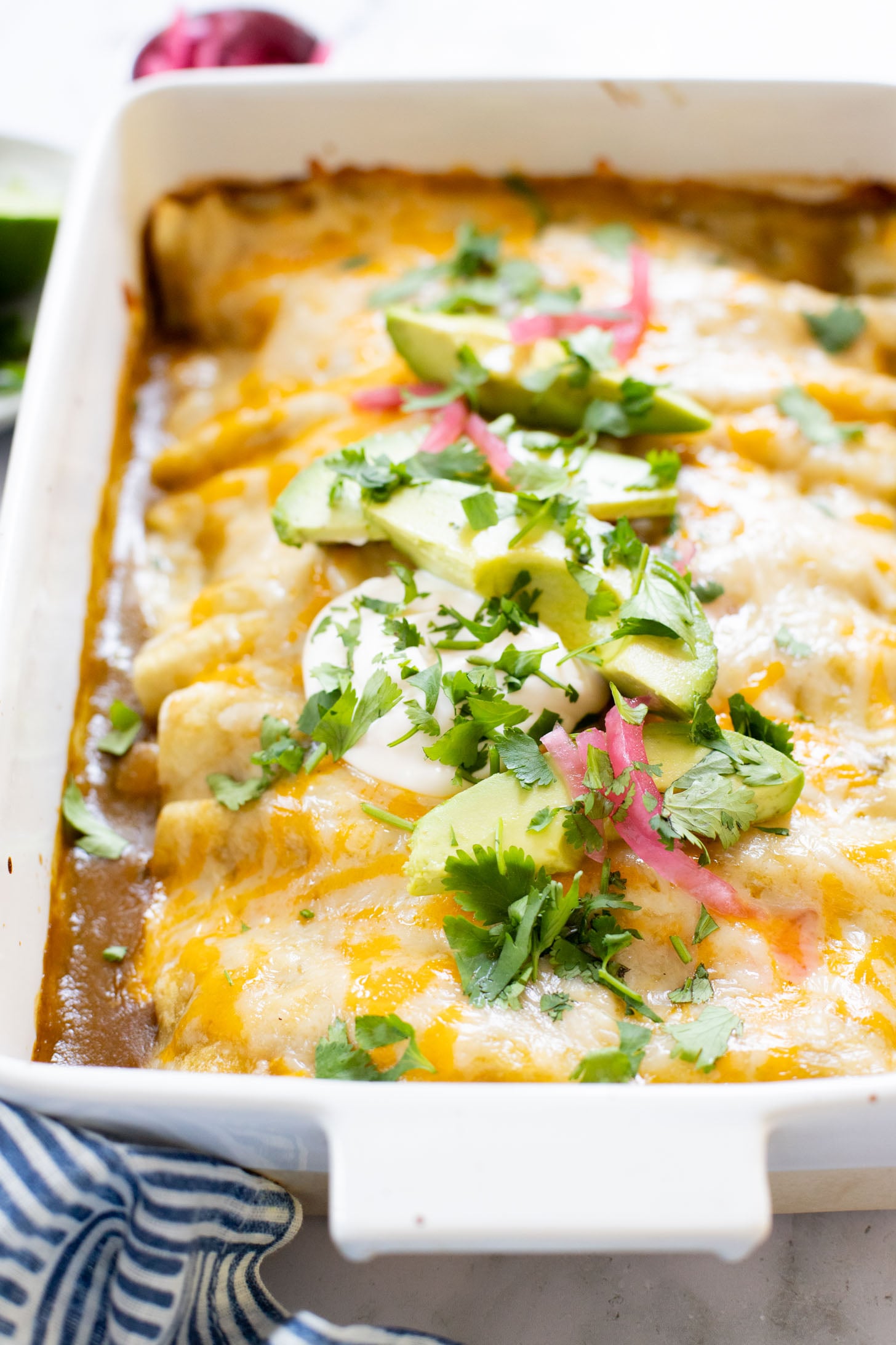 These Black Bean & Zucchini Enchiladas are the perfect way to use up summer zucchini. These enchiladas are dairy-free and delicious | ThisSavoryVegan.com