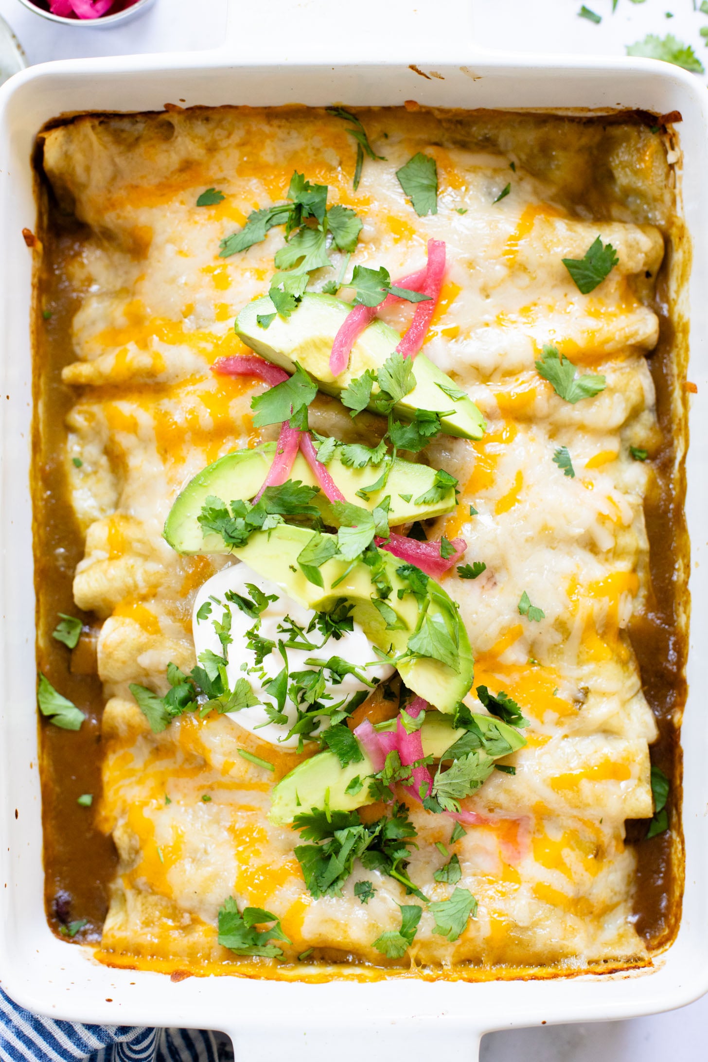 These Black Bean & Zucchini Enchiladas are the perfect way to use up summer zucchini. These enchiladas are dairy-free and delicious | ThisSavoryVegan.com