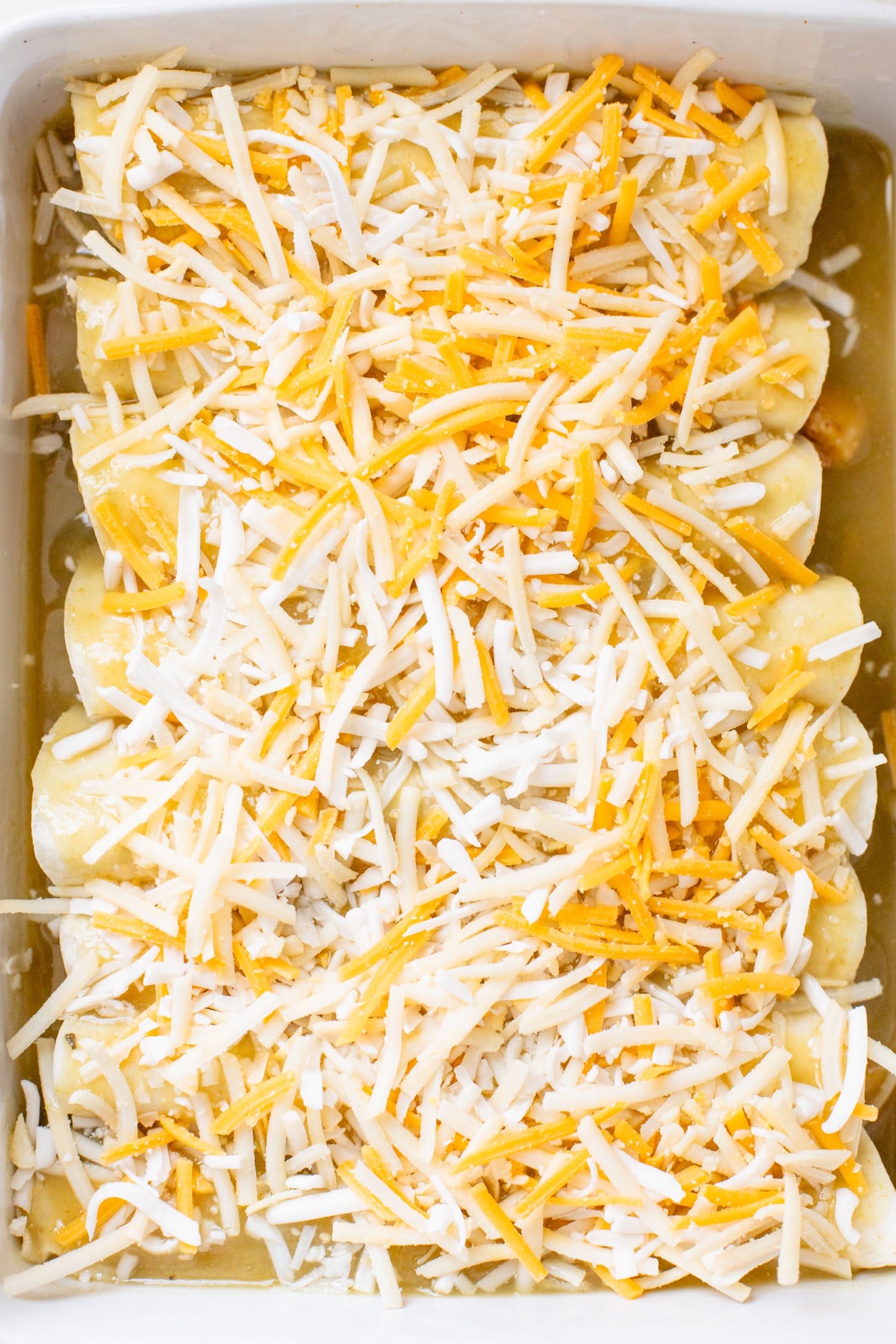 These Black Bean & Zucchini Enchiladas are the perfect way to use up summer zucchini. These enchiladas are dairy-free and delicious | ThisSavoryVegan.com