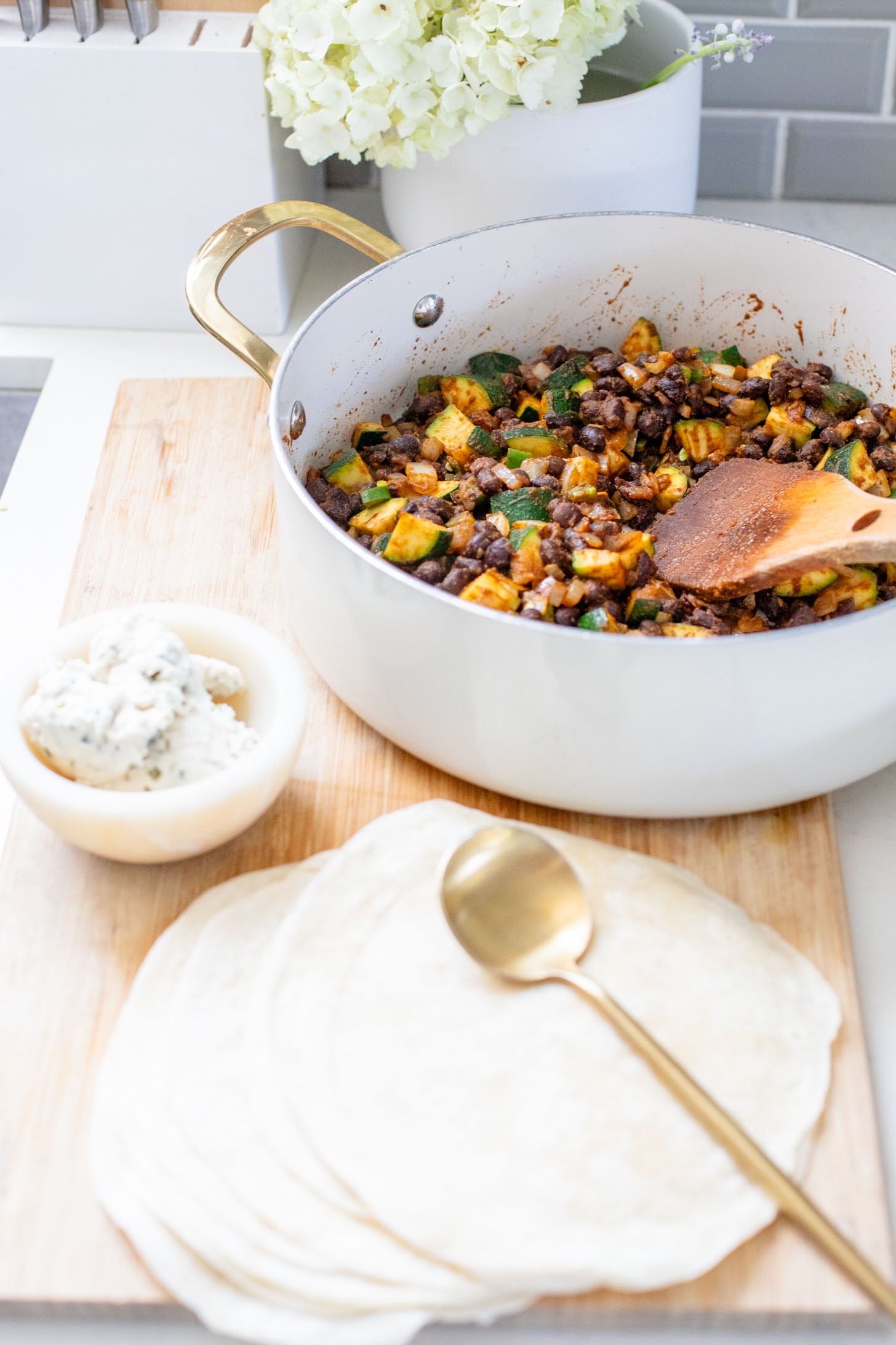 These Black Bean & Zucchini Enchiladas are the perfect way to use up summer zucchini. These enchiladas are dairy-free and delicious | ThisSavoryVegan.com