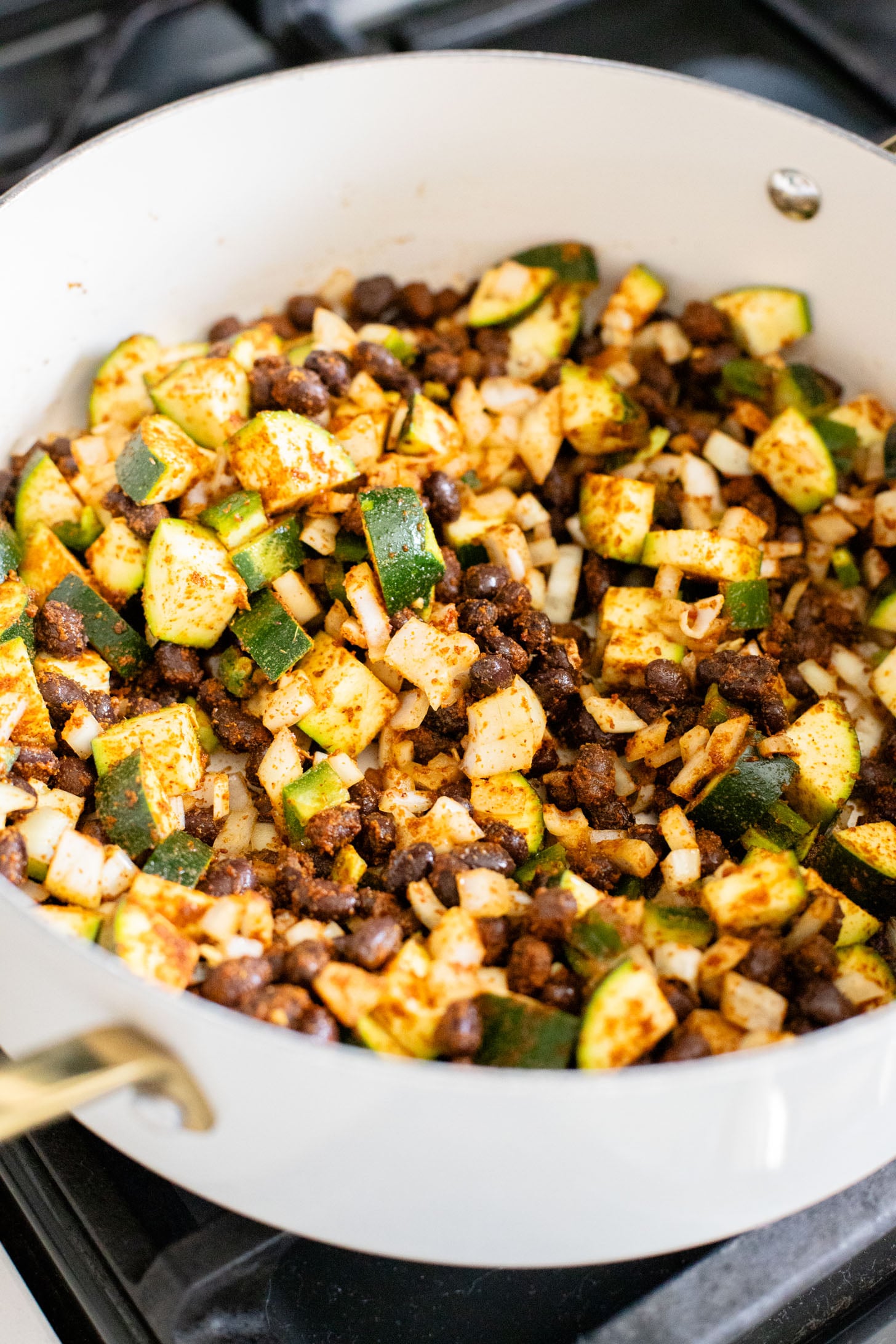 These Black Bean & Zucchini Enchiladas are the perfect way to use up summer zucchini. These enchiladas are dairy-free and delicious | ThisSavoryVegan.com