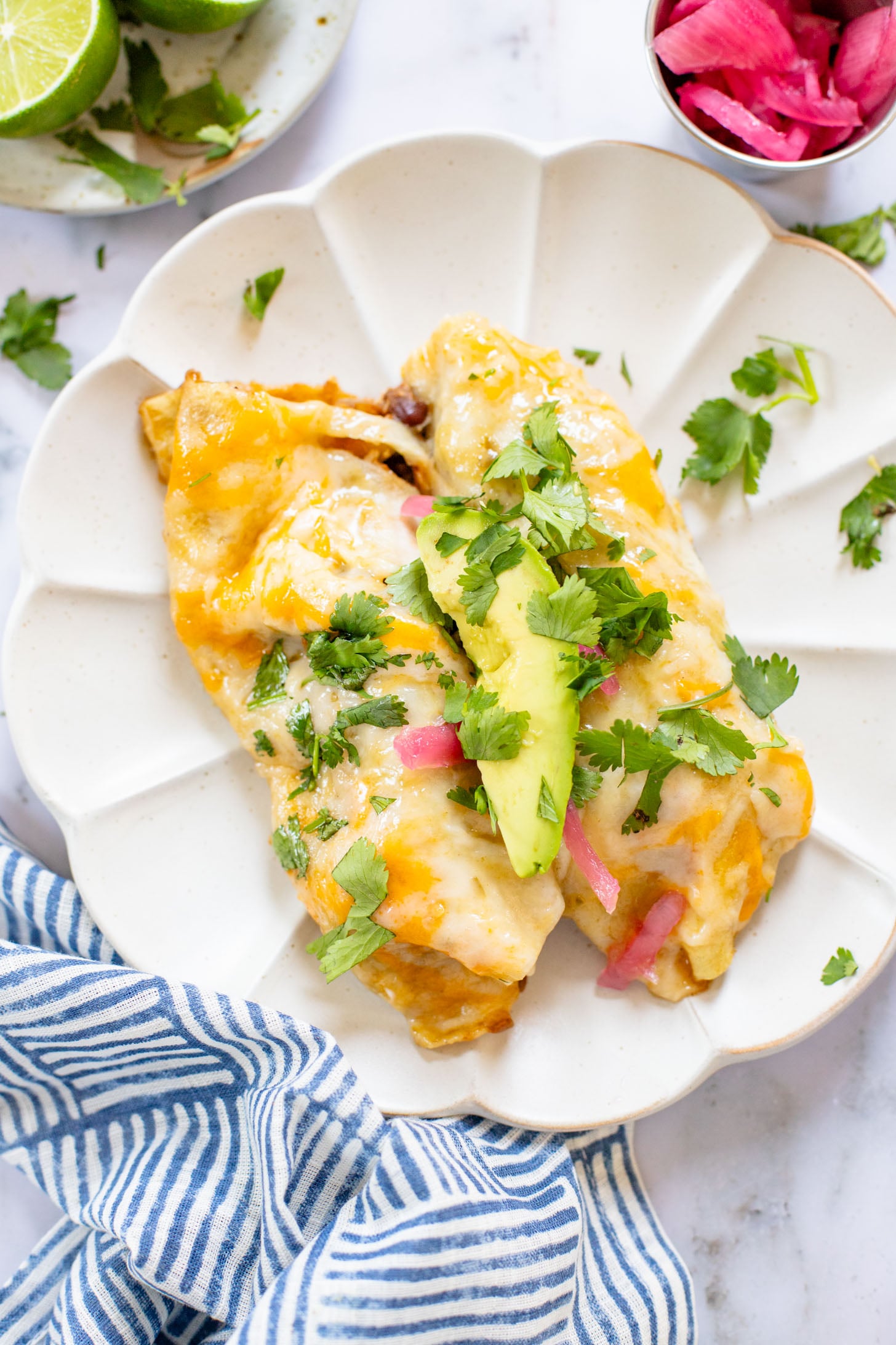 These Black Bean & Zucchini Enchiladas are the perfect way to use up summer zucchini. These enchiladas are dairy-free and delicious | ThisSavoryVegan.com