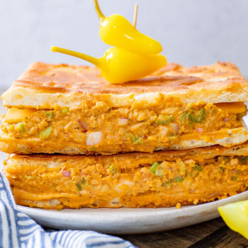 This Buffalo Chickpea Melt is the most comforting (and quick) vegan sandwich! Made with dairy-free cheese & the best chickpea salad | ThisSavoryVegan.com