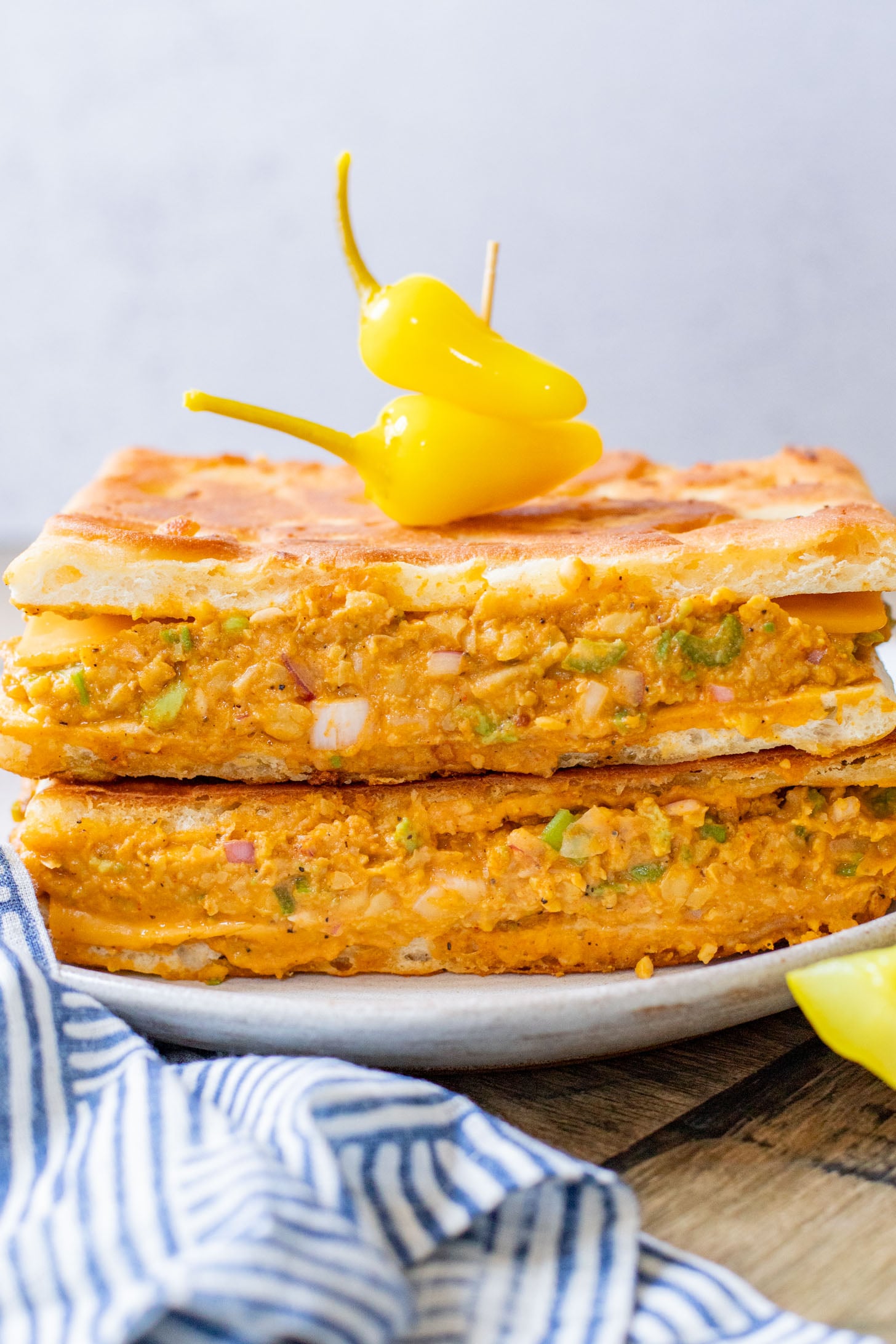 This Buffalo Chickpea Melt is the most comforting (and quick) vegan sandwich! Made with dairy-free cheese & the best chickpea salad | ThisSavoryVegan.com