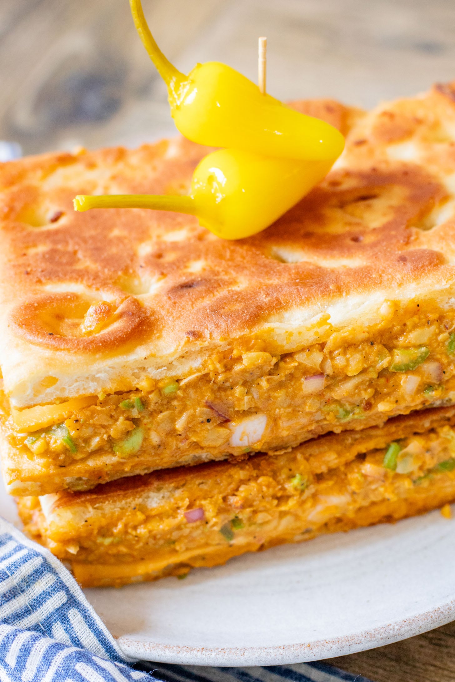 This Buffalo Chickpea Melt is the most comforting (and quick) vegan sandwich! Made with dairy-free cheese & the best chickpea salad | ThisSavoryVegan.com