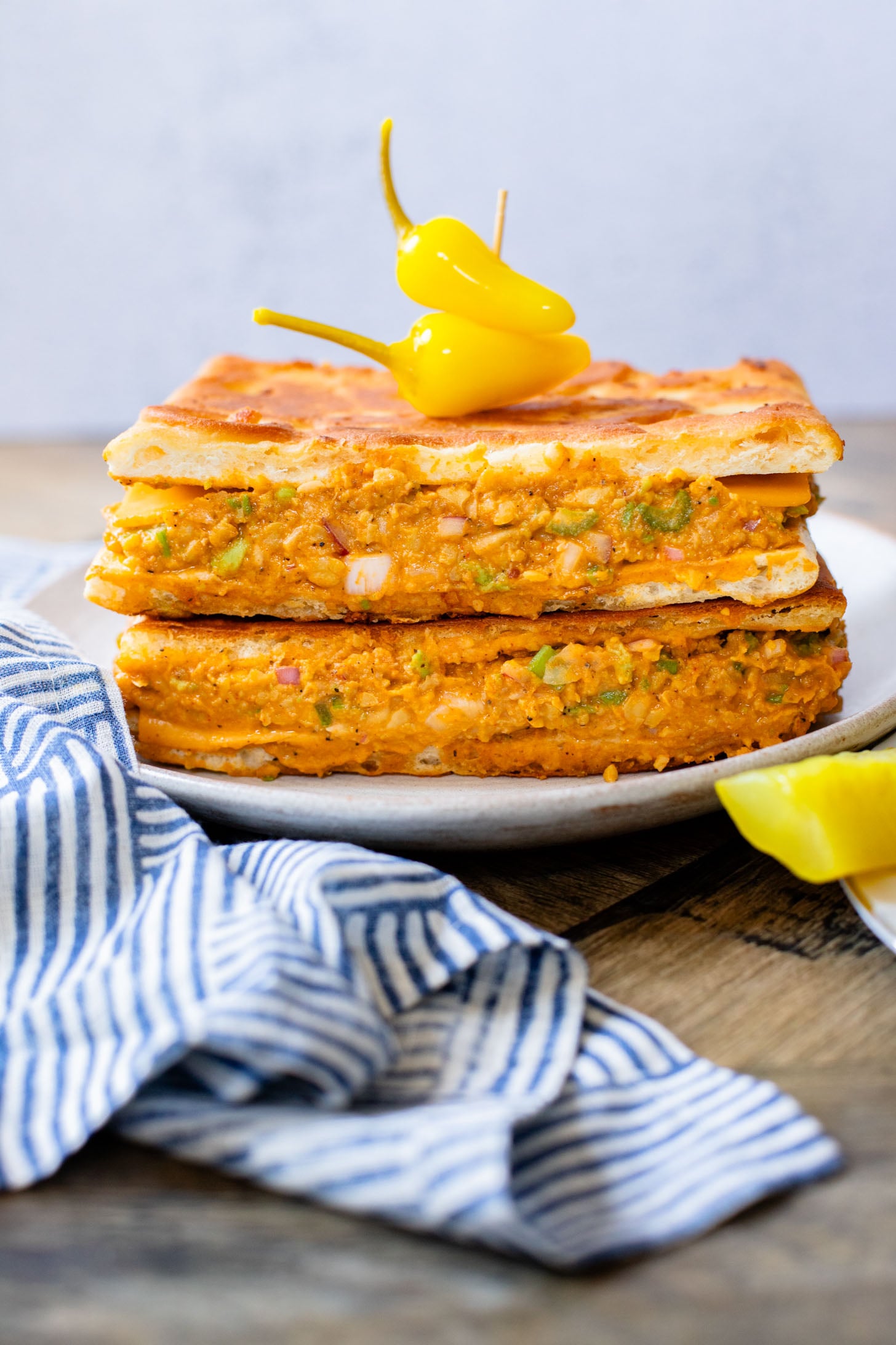 This Buffalo Chickpea Melt is the most comforting (and quick) vegan sandwich! Made with dairy-free cheese & the best chickpea salad | ThisSavoryVegan.com