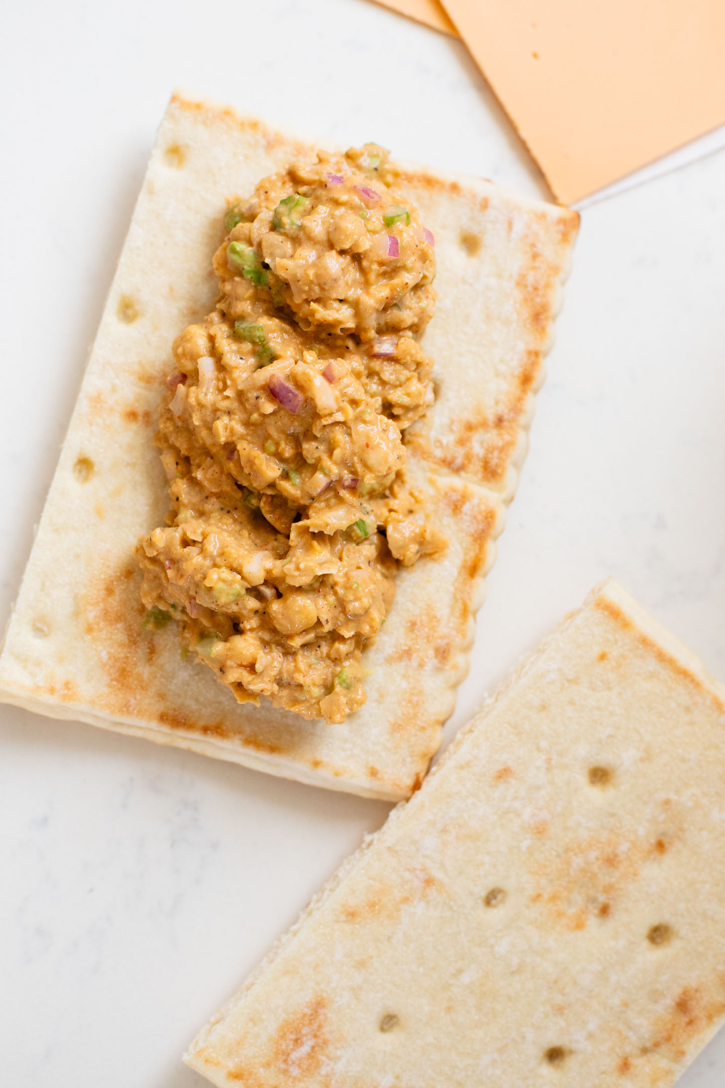 This Buffalo Chickpea Melt is the most comforting (and quick) vegan sandwich! Made with dairy-free cheese & the best chickpea salad | ThisSavoryVegan.com