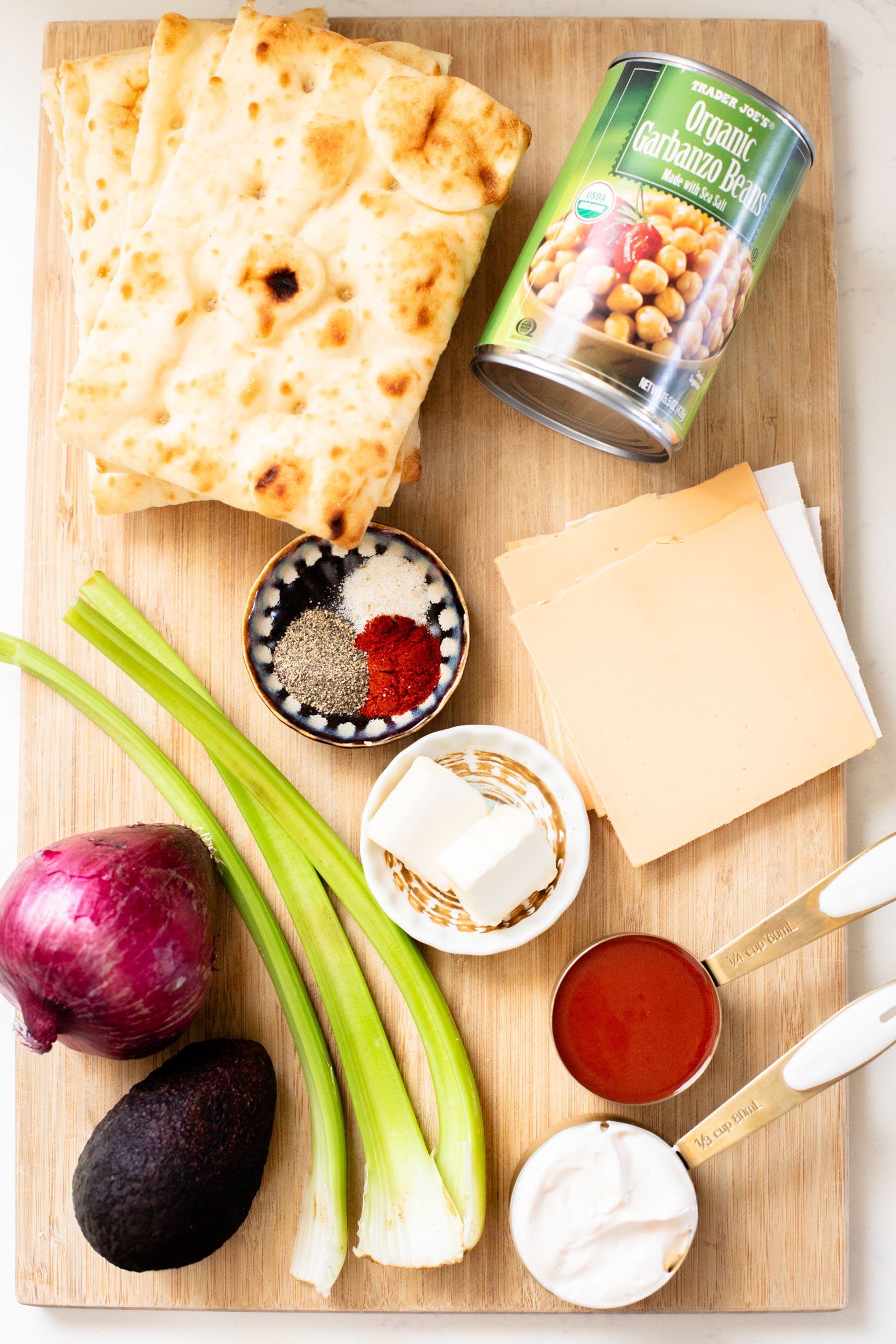 This Buffalo Chickpea Melt is the most comforting (and quick) vegan sandwich! Made with dairy-free cheese & the best chickpea salad | ThisSavoryVegan.com