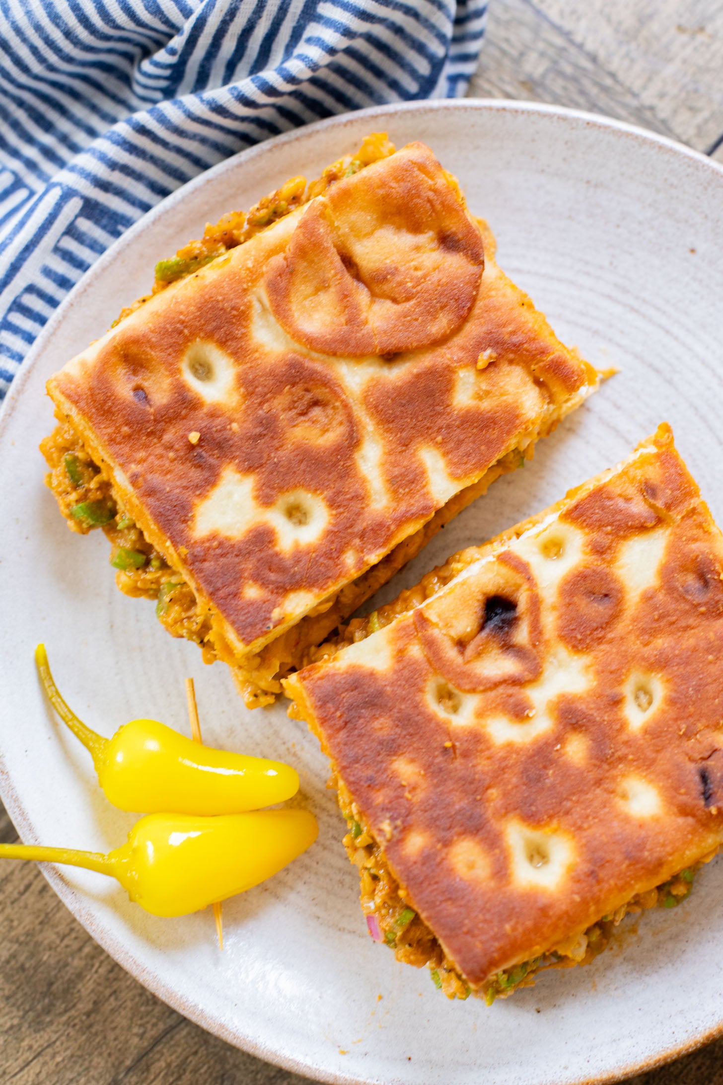 This Buffalo Chickpea Melt is the most comforting (and quick) vegan sandwich! Made with dairy-free cheese & the best chickpea salad | ThisSavoryVegan.com