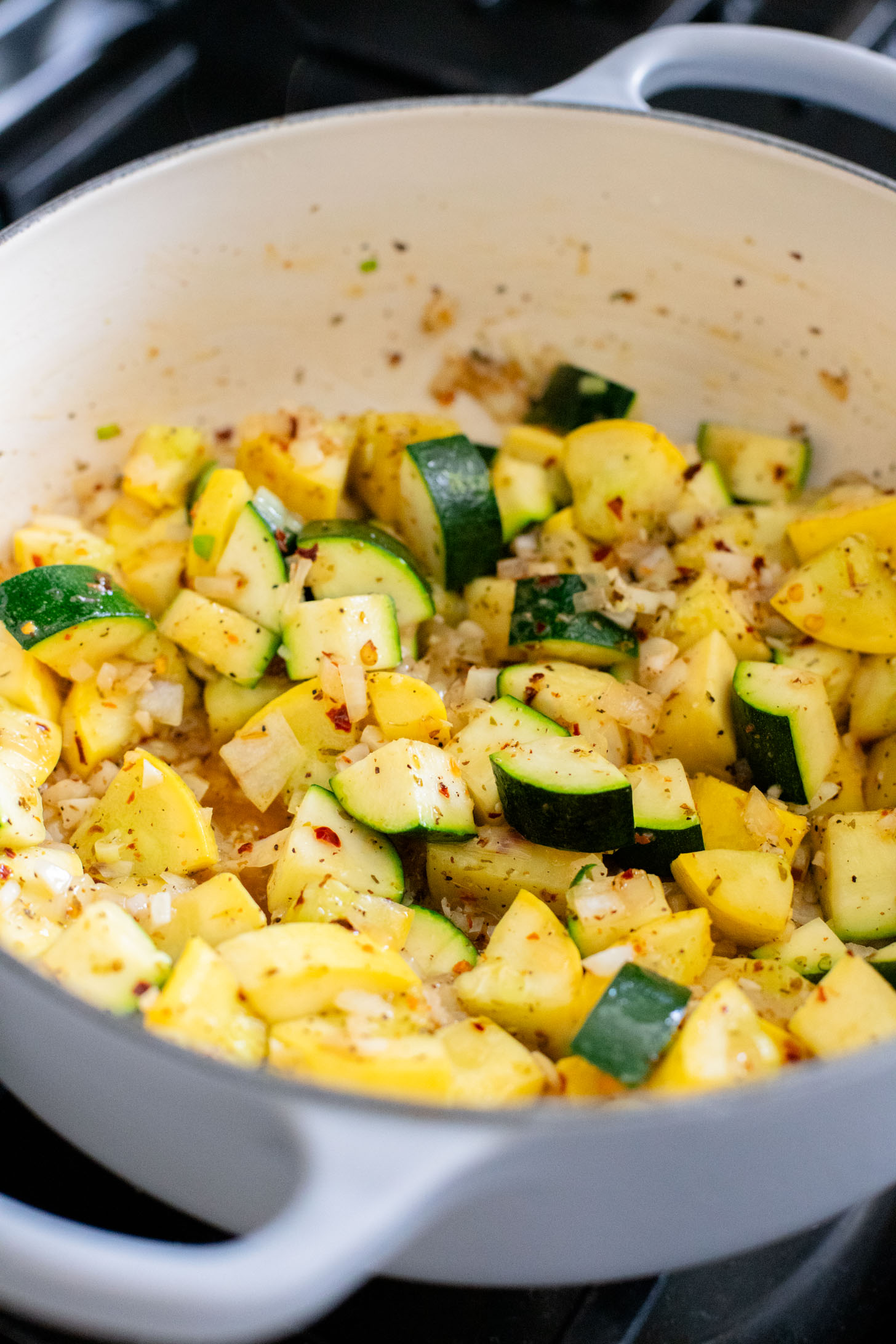 This Cheesy Zucchini Penne is a one-pot, dairy-free dinner! Packed with summer squash, marinara and a cheesy topping | ThisSavoryVegan.com