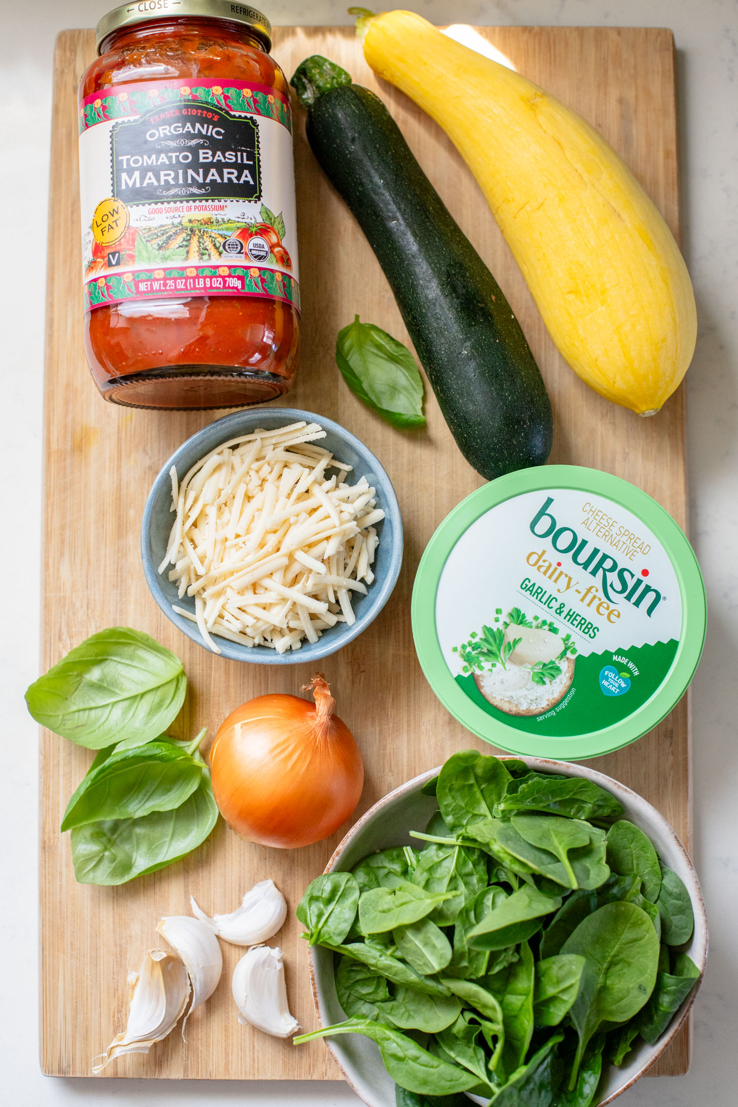 This Cheesy Zucchini Penne is a one-pot, dairy-free dinner! Packed with summer squash, marinara and a cheesy topping | ThisSavoryVegan.com