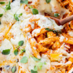This Cheesy Zucchini Penne is a one-pot, dairy-free dinner! Packed with summer squash, marinara and a cheesy topping | ThisSavoryVegan.com