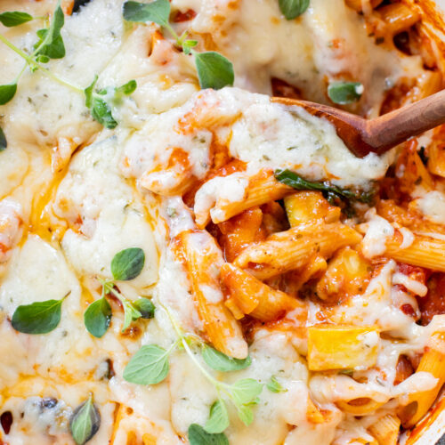 This Cheesy Zucchini Penne is a one-pot, dairy-free dinner! Packed with summer squash, marinara and a cheesy topping | ThisSavoryVegan.com