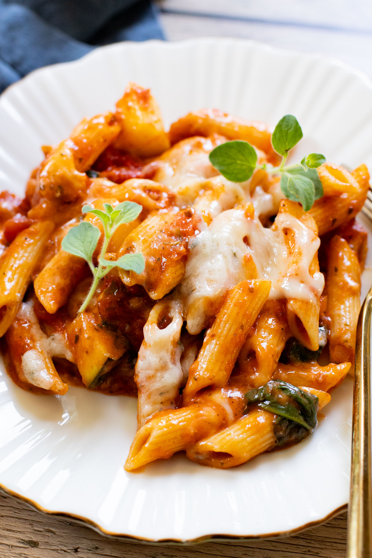 This Cheesy Zucchini Penne is a one-pot, dairy-free dinner! Packed with summer squash, marinara and a cheesy topping | ThisSavoryVegan.com