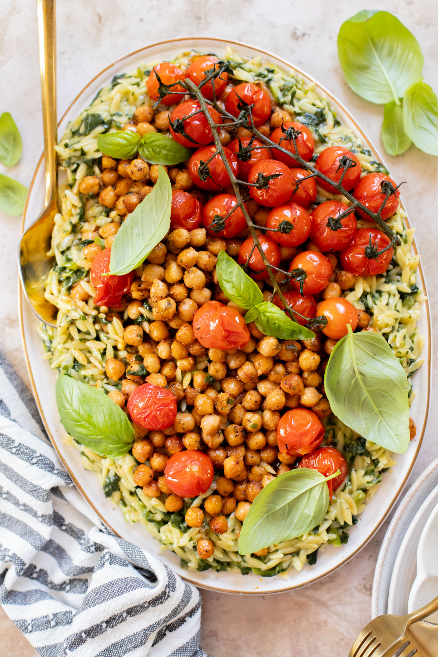 This Creamy Spinach Orzo with Burst Tomatoes is dairy-free and packed with summer flavors. A tasty side dish or main | ThisSavoryVegan.com