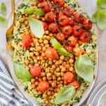 This Creamy Spinach Orzo with Burst Tomatoes is dairy-free and packed with summer flavors. A tasty side dish or main | ThisSavoryVegan.com