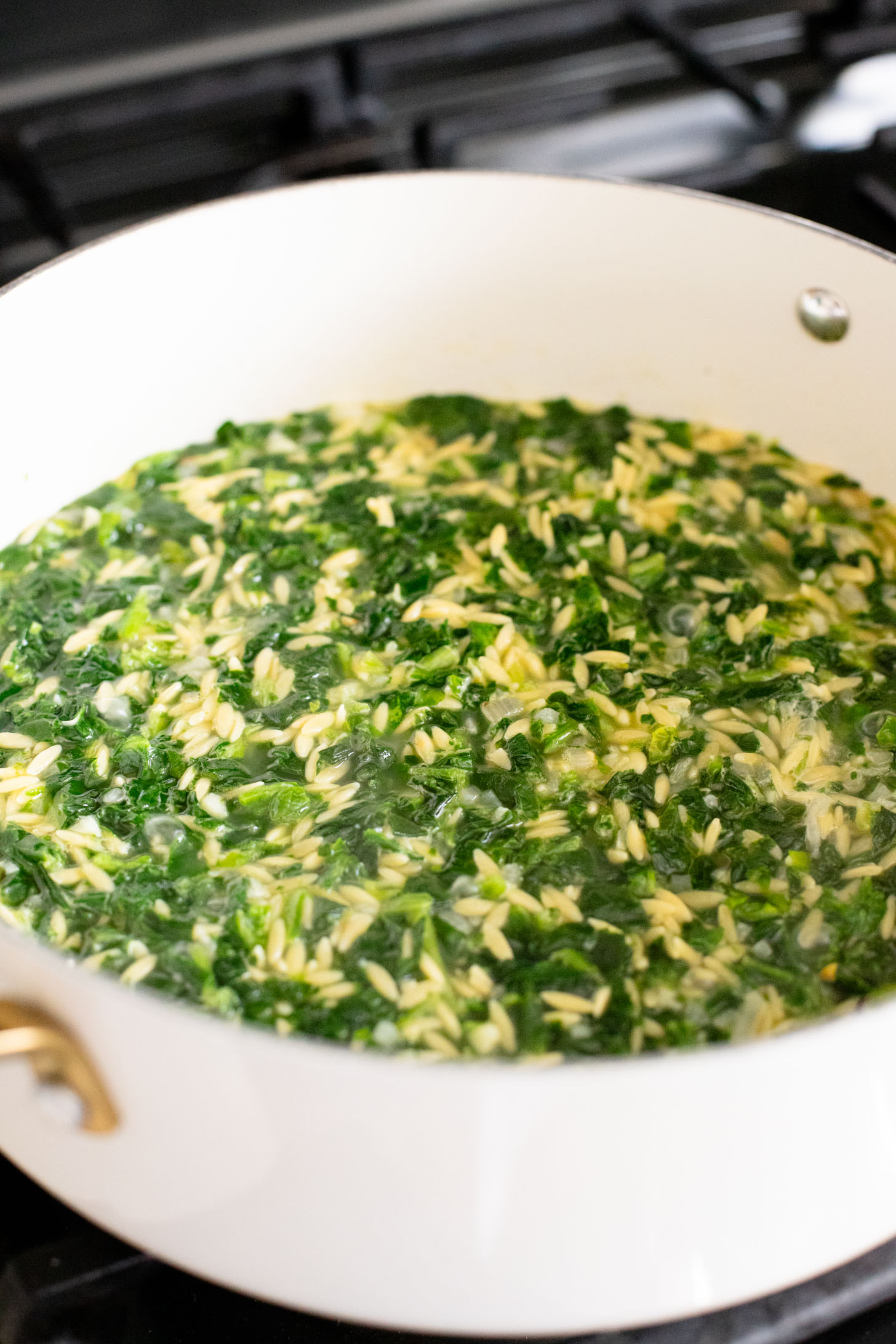This Creamy Spinach Orzo with Burst Tomatoes is dairy-free and packed with summer flavors. A tasty side dish or main | ThisSavoryVegan.com