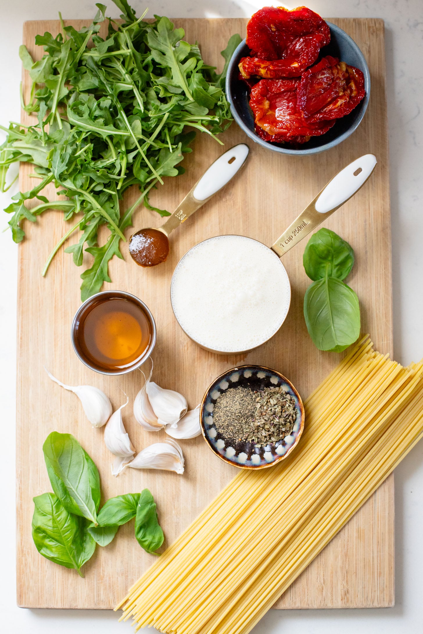 This Creamy Sun-Dried Tomato Spaghetti is totally dairy-free and only requires a handful of ingredients. The perfect one-pot pasta recipe | ThisSavoryVegan.com