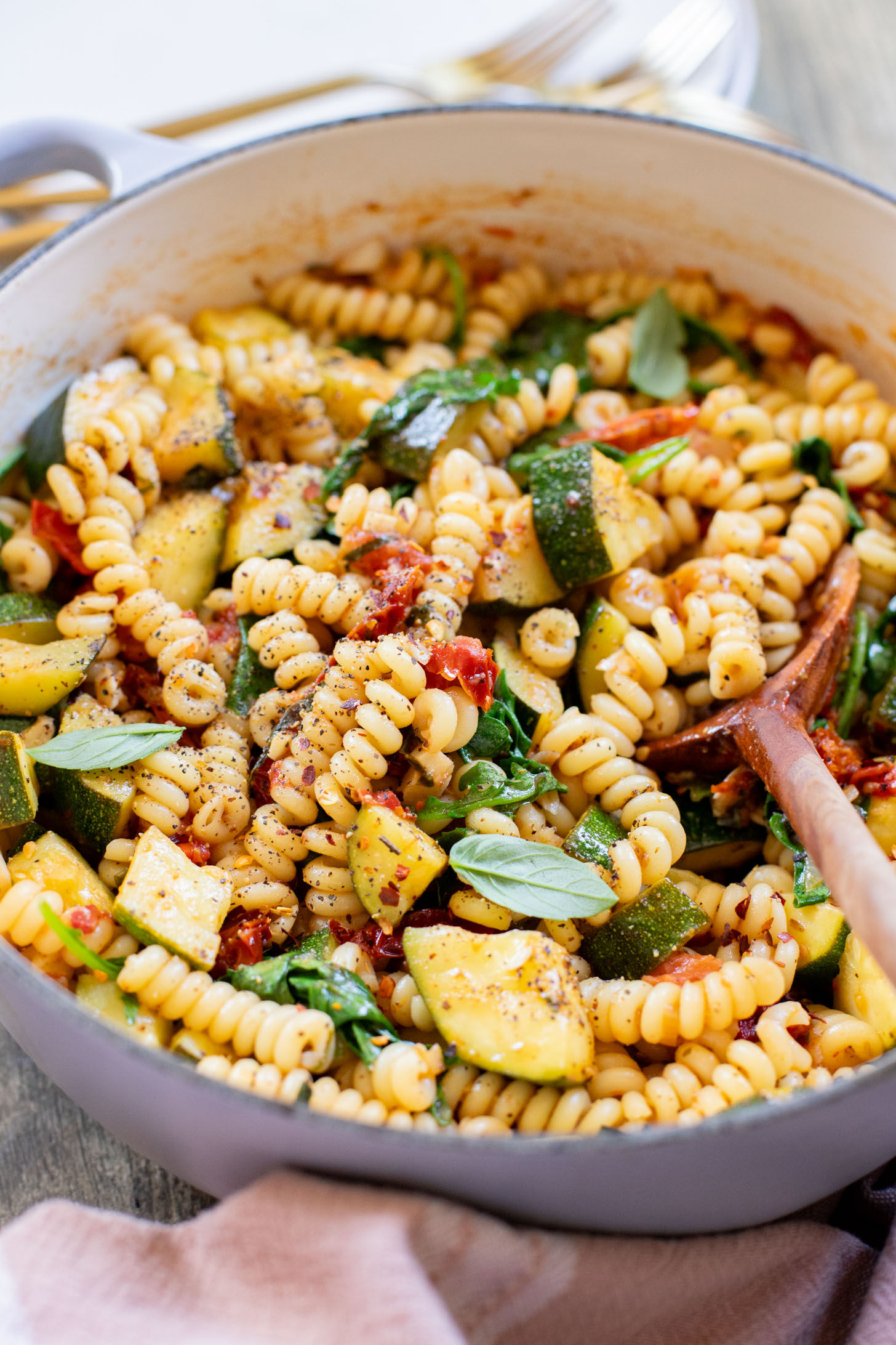 This One-Pot Summer Veggie Pasta is ready in 30 minutes and is filled with zucchini, tomatoes, greens & basil. Simple & delicious vegan pasta | ThisSavoryVegan.com