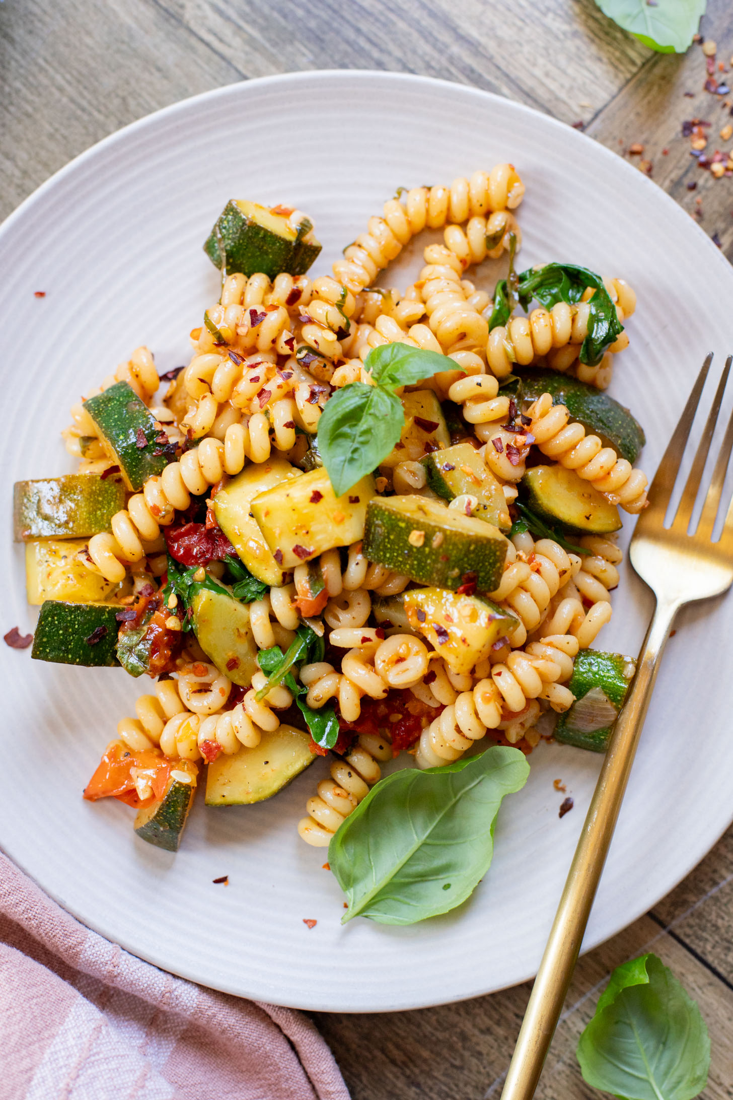 This One-Pot Summer Veggie Pasta is ready in 30 minutes and is filled with zucchini, tomatoes, greens & basil. Simple & delicious vegan pasta | ThisSavoryVegan.com