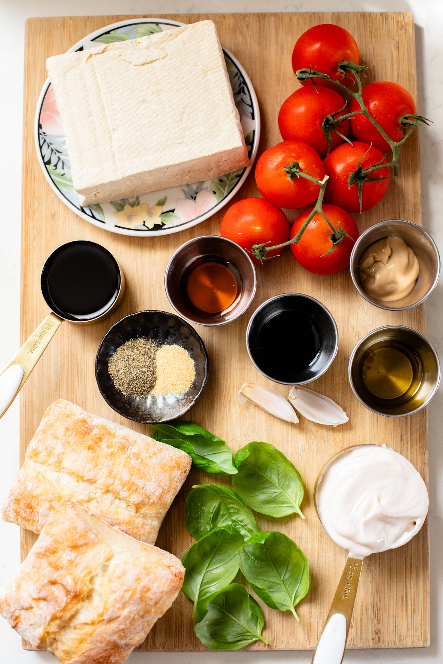 These Tofu Bruschetta Sandwiches are layered with vegan basil mayo, crispy balsamic tofu steaks and marinated tomatoes & basil | ThisSavoryVegan.com