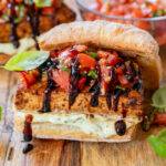 These Tofu Bruschetta Sandwiches are layered with vegan basil mayo, crispy balsamic tofu steaks and marinated tomatoes & basil | ThisSavoryVegan.com