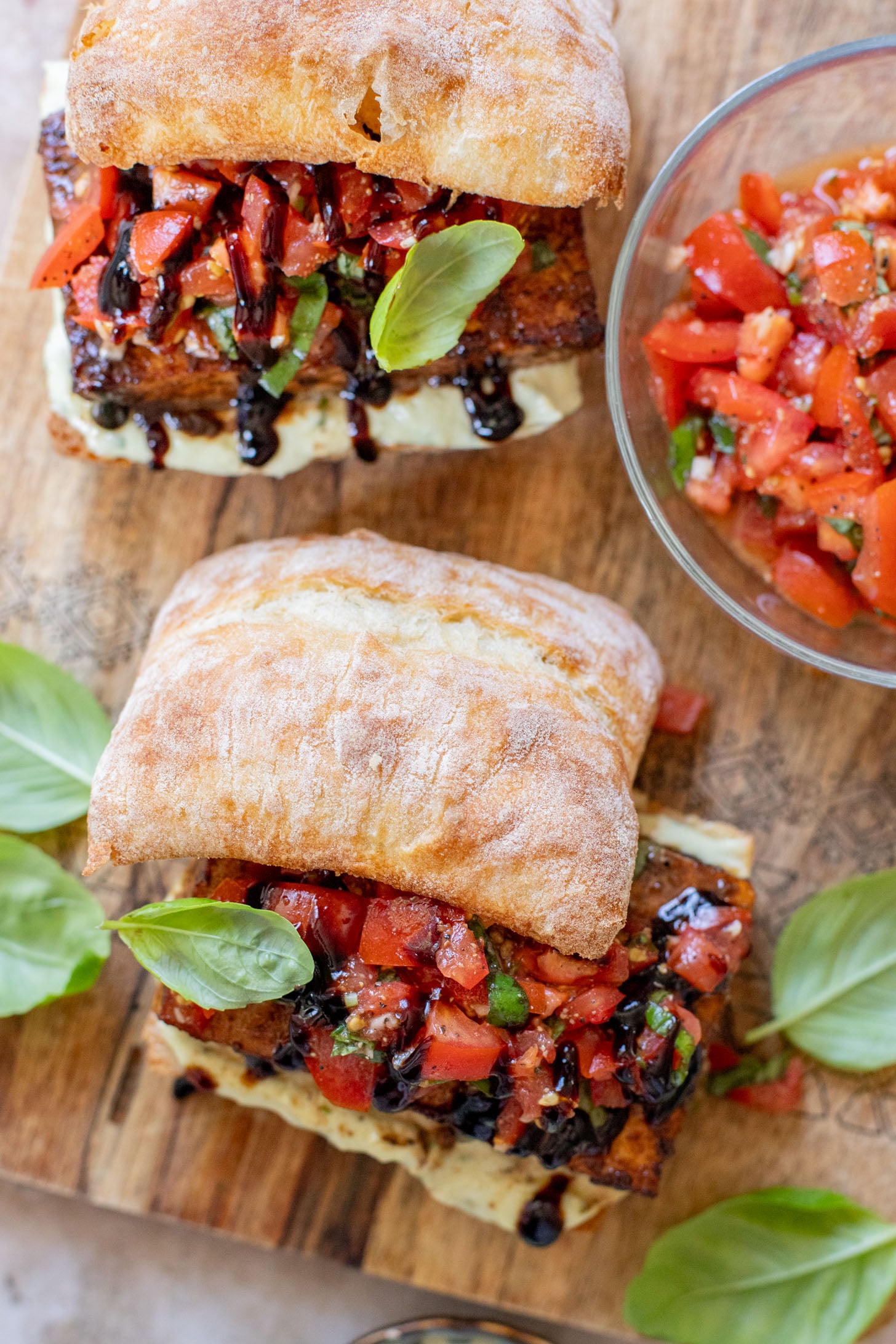 These Tofu Bruschetta Sandwiches are layered with vegan basil mayo, crispy balsamic tofu steaks and marinated tomatoes & basil | ThisSavoryVegan.com