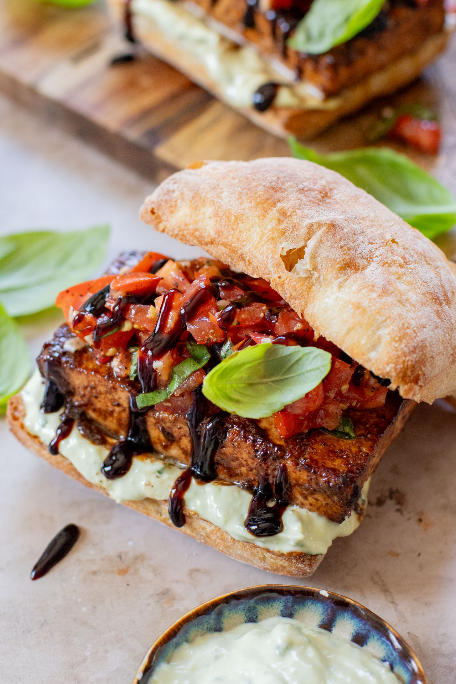 These Tofu Bruschetta Sandwiches are layered with vegan basil mayo, crispy balsamic tofu steaks and marinated tomatoes & basil | ThisSavoryVegan.com