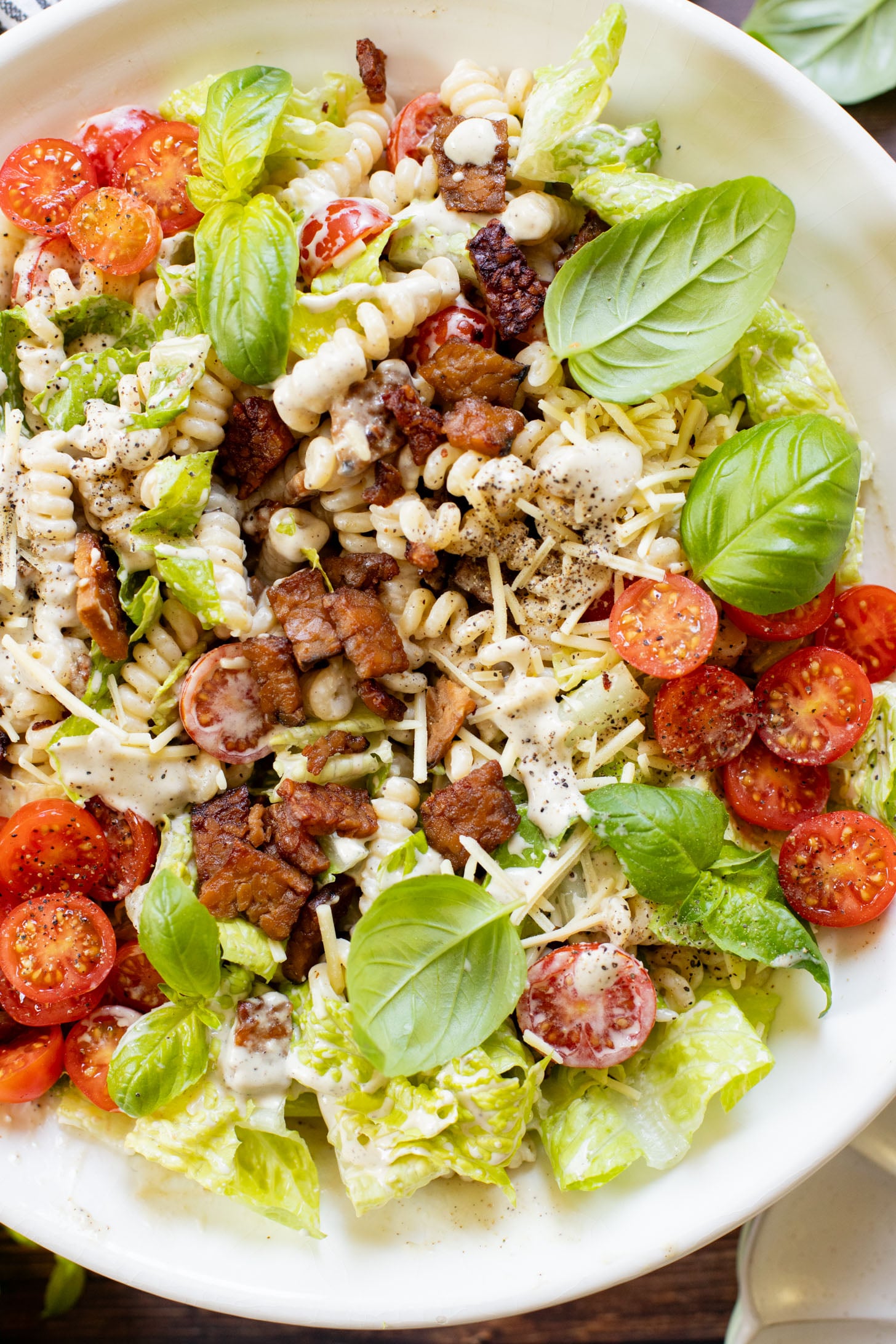 This Vegan BLT Caesar Pasta Salad is the perfect addition to your next picnic or BBQ. Made with the best dairy-free Caesar dressing | ThisSavoryVegan.com