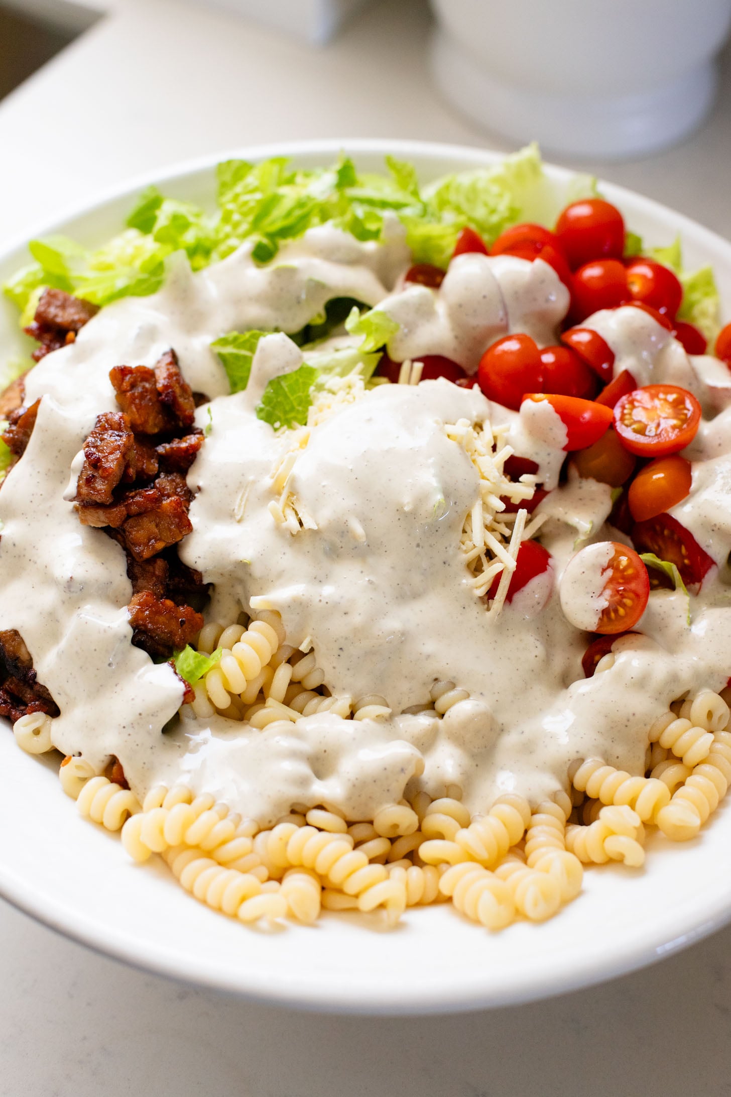 This Vegan BLT Caesar Pasta Salad is the perfect addition to your next picnic or BBQ. Made with the best dairy-free Caesar dressing | ThisSavoryVegan.com