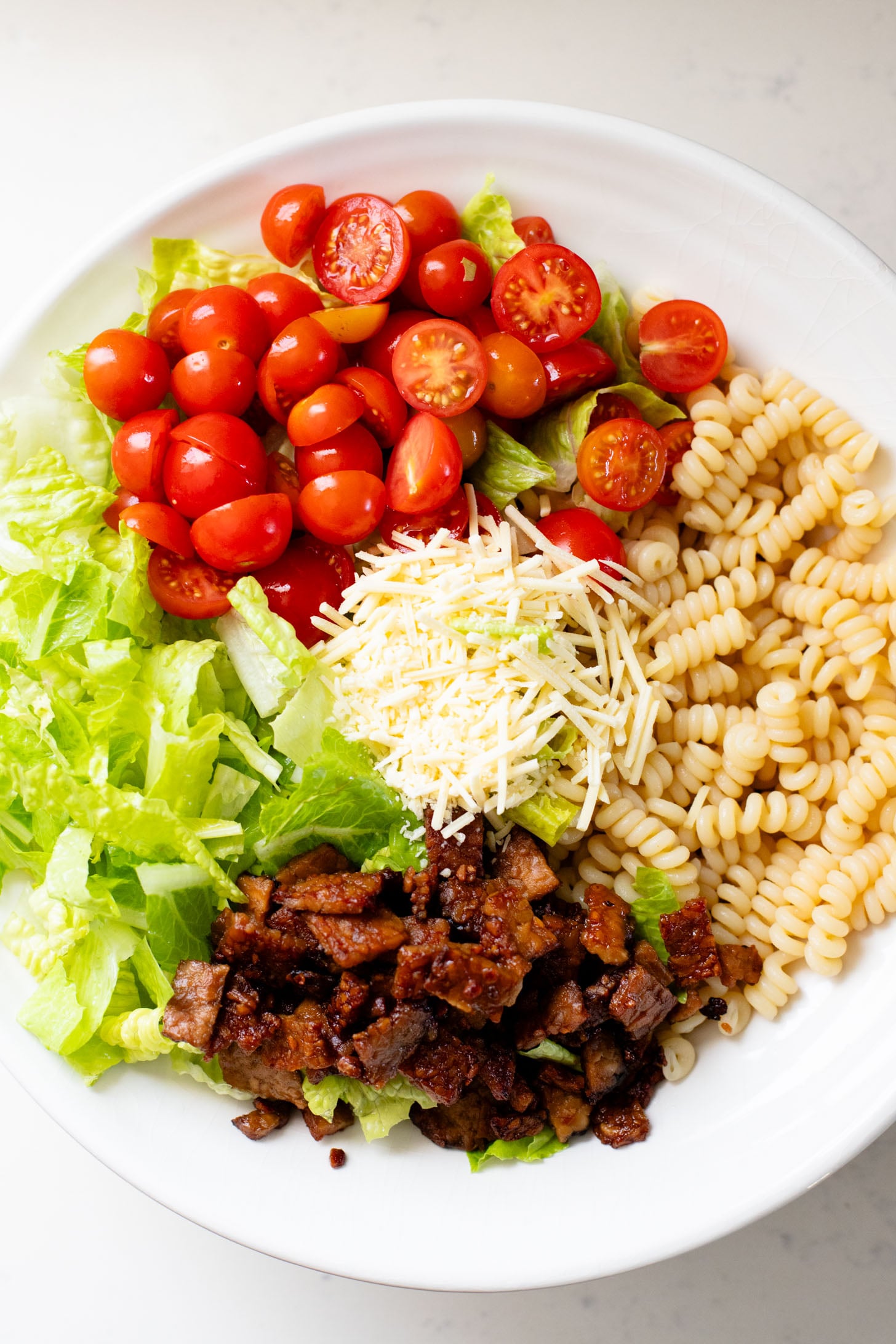 This Vegan BLT Caesar Pasta Salad is the perfect addition to your next picnic or BBQ. Made with the best dairy-free Caesar dressing | ThisSavoryVegan.com