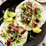 These Vegan Chicken Tacos are a must make! The vegan chicken is smoky & charred and the tacos are topped with a jalapeño cilantro sauce | ThisSavoryVegan.com