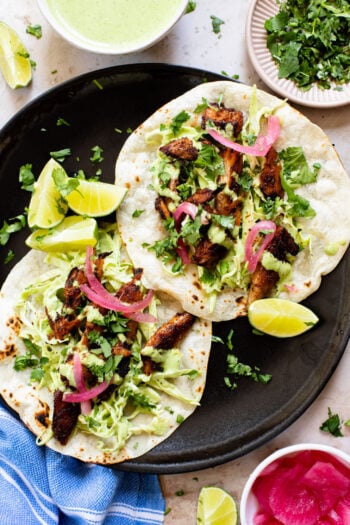 These Vegan Chicken Tacos are a must make! The vegan chicken is smoky & charred and the tacos are topped with a jalapeño cilantro sauce | ThisSavoryVegan.com