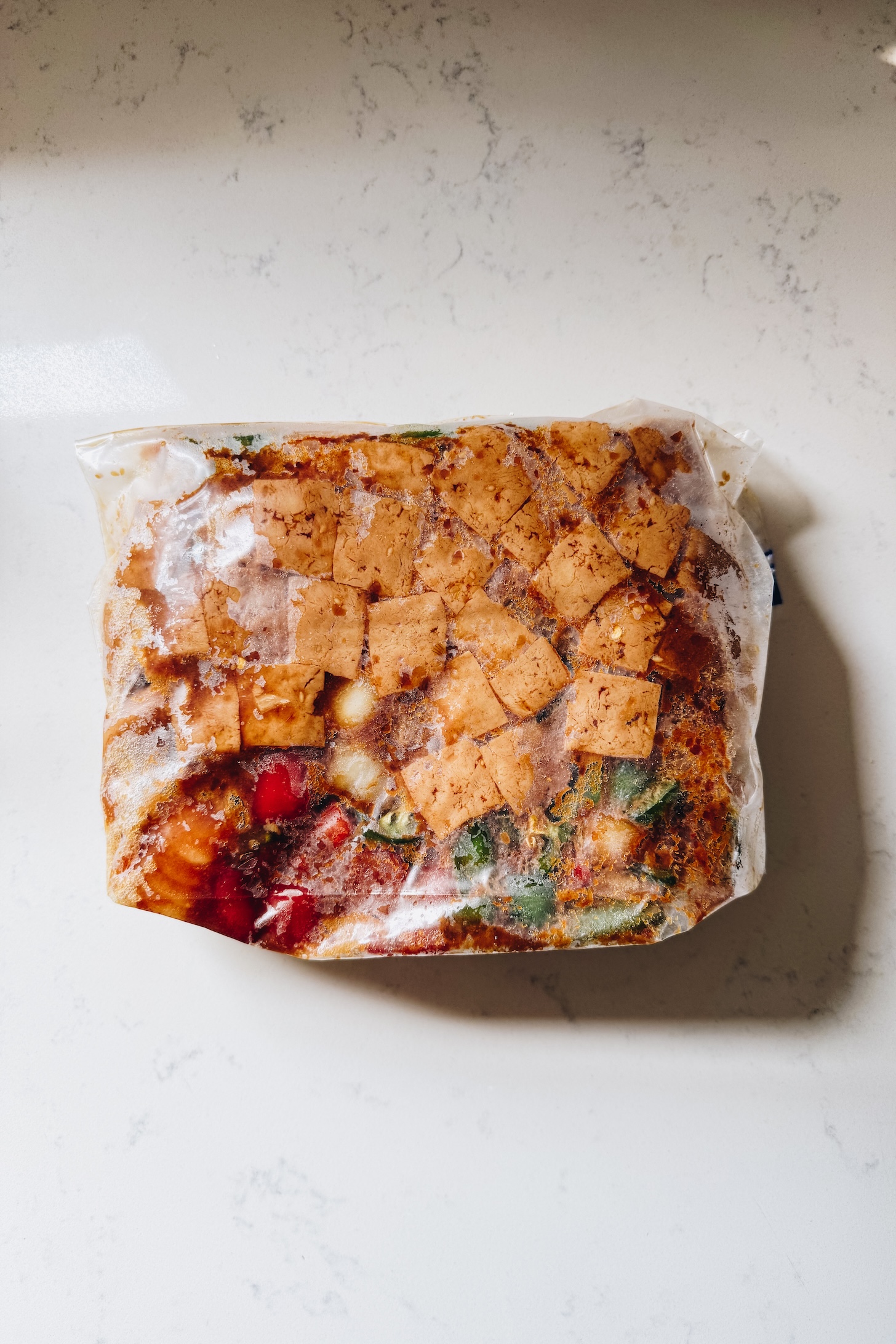 Take a peek inside my freezer to see what I prepped for post-baby! I have a mix of homemade meals and some fun vegan frozen finds | ThisSavoryVegan.com