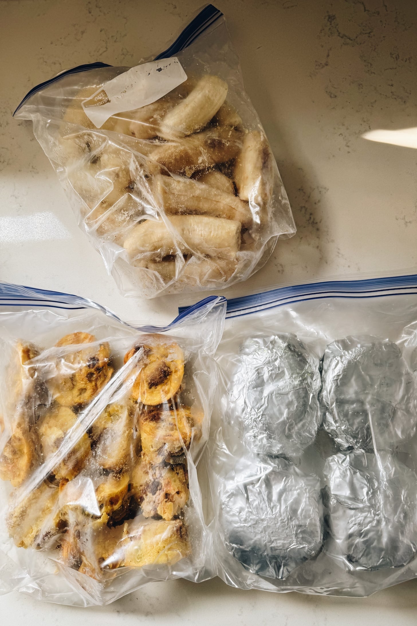 Take a peek inside my freezer to see what I prepped for post-baby! I have a mix of homemade meals and some fun vegan frozen finds | ThisSavoryVegan.com