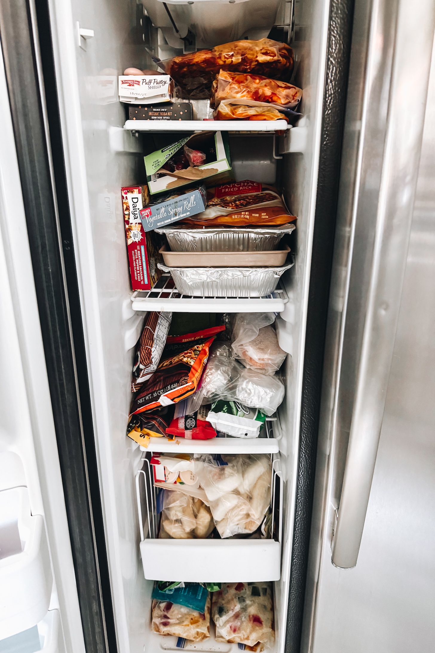 Take a peek inside my freezer to see what I prepped for post-baby! I have a mix of homemade meals and some fun vegan frozen finds | ThisSavoryVegan.com