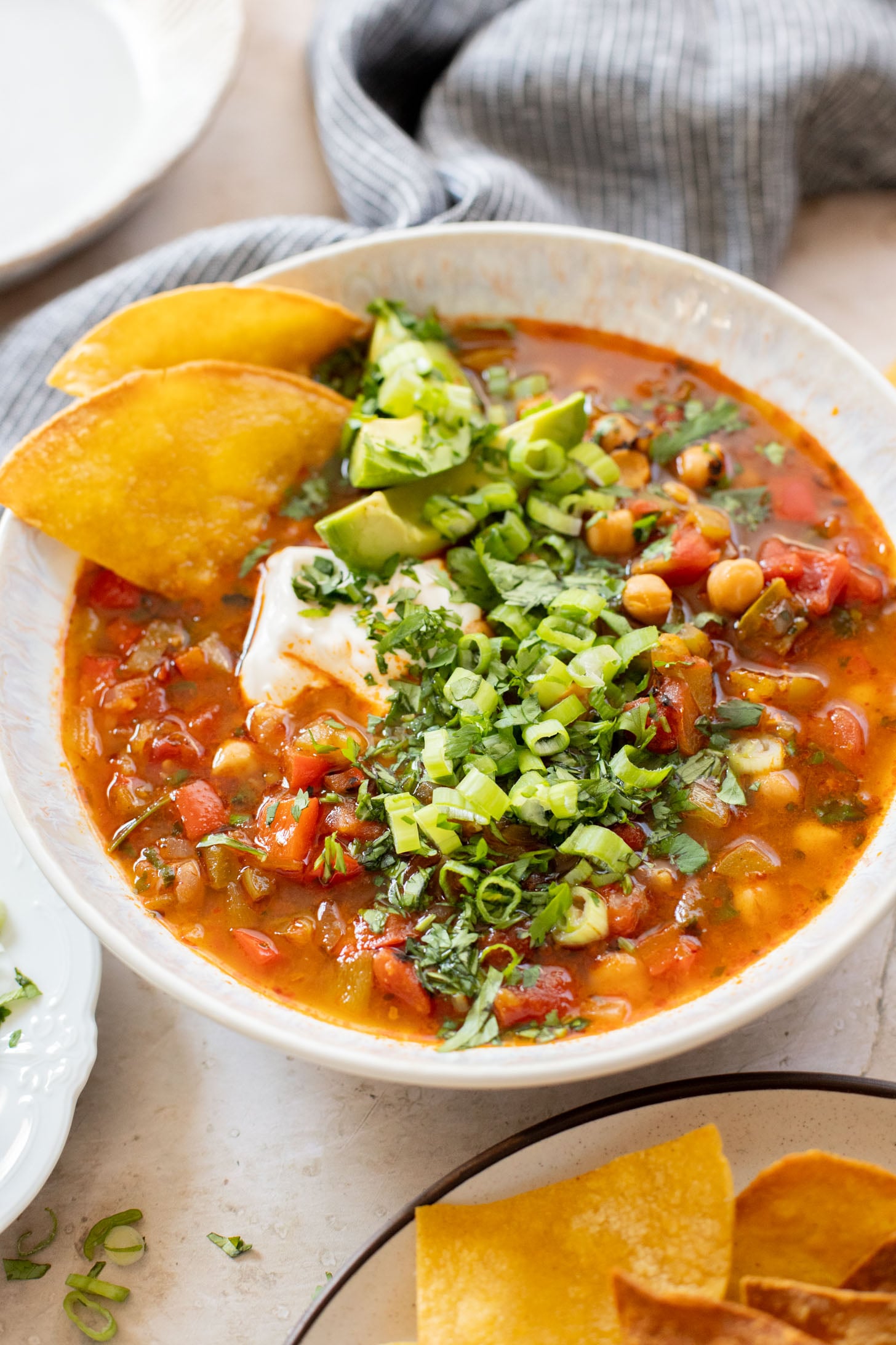 This Chickpea Taco Soup is a simple, clean soup recipe that doesn't skip on flavor. Packed with veggies and plant protein | ThisSavoryVegan.com