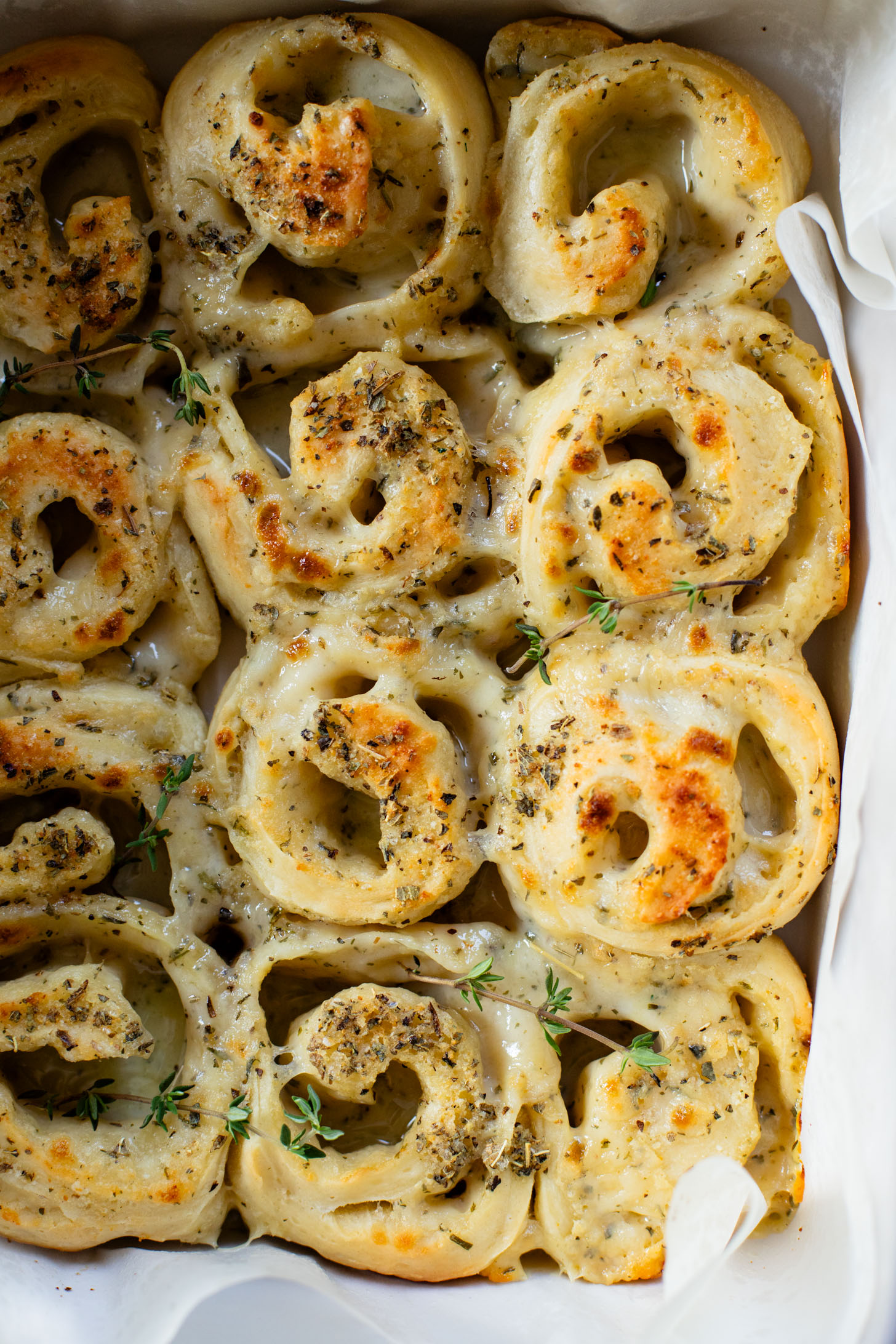 These Cheesy Vegan Swirl Buns are a dairy-free, comforting side dish that are perfect for the holidays! Cheesy, garlicky & delicious | ThisSavoryVegan.com