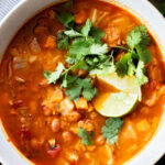 This Smoky Cabbage Soup is a healthy blend of tender cabbage, pinto beans & soy chorizo. Plant-based soup that is easy & delicious | ThisSavoryVegan.com