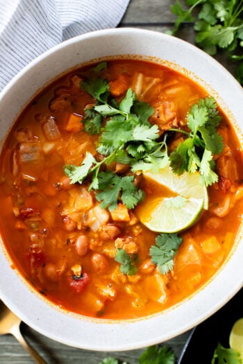 This Smoky Cabbage Soup is a healthy blend of tender cabbage, pinto beans & soy chorizo. Plant-based soup that is easy & delicious | ThisSavoryVegan.com