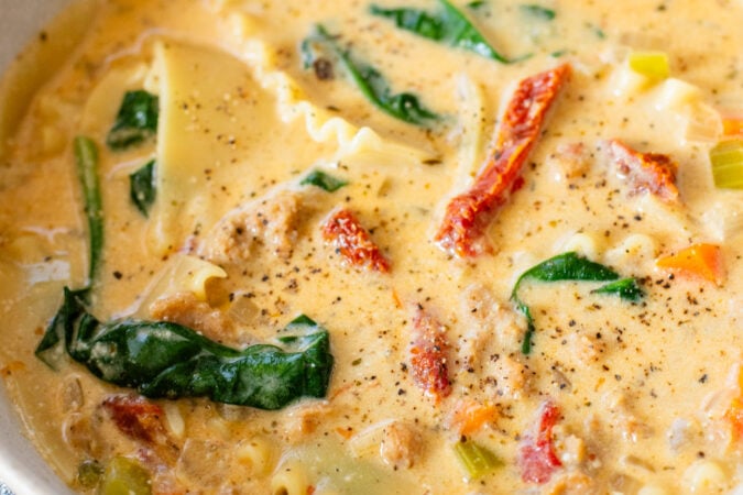 This Creamy Vegan Lasagna Soup is comfort food in a bowl. It is a cozy, one-pot dinner that the whole family will love | ThisSavoryVegan.com