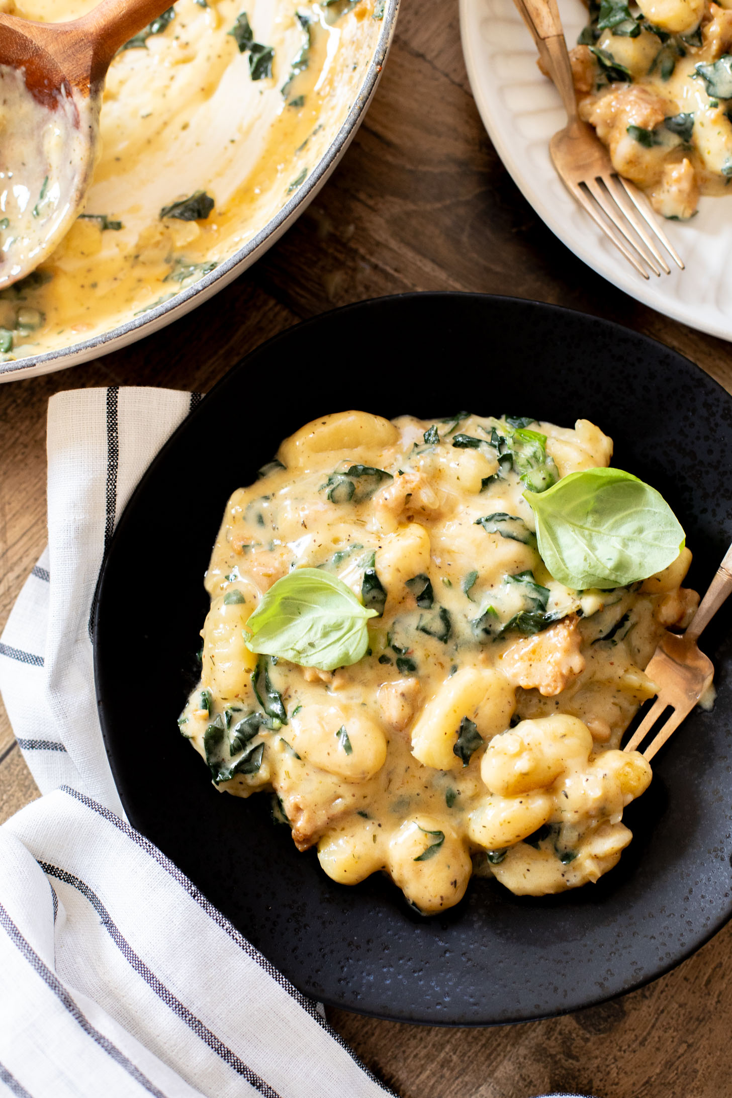 This Vegan Baked Sausage & Kale Gnocchi is a cheesy, comfort food dish. Made in one pot and baked until hot & bubbly | ThisSavoryVegan.com