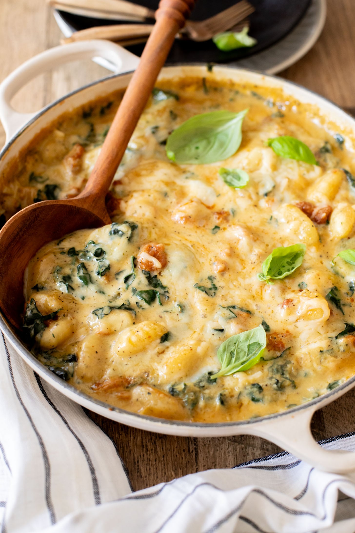 This Vegan Baked Sausage & Kale Gnocchi is a cheesy, comfort food dish. Made in one pot and baked until hot & bubbly | ThisSavoryVegan.com